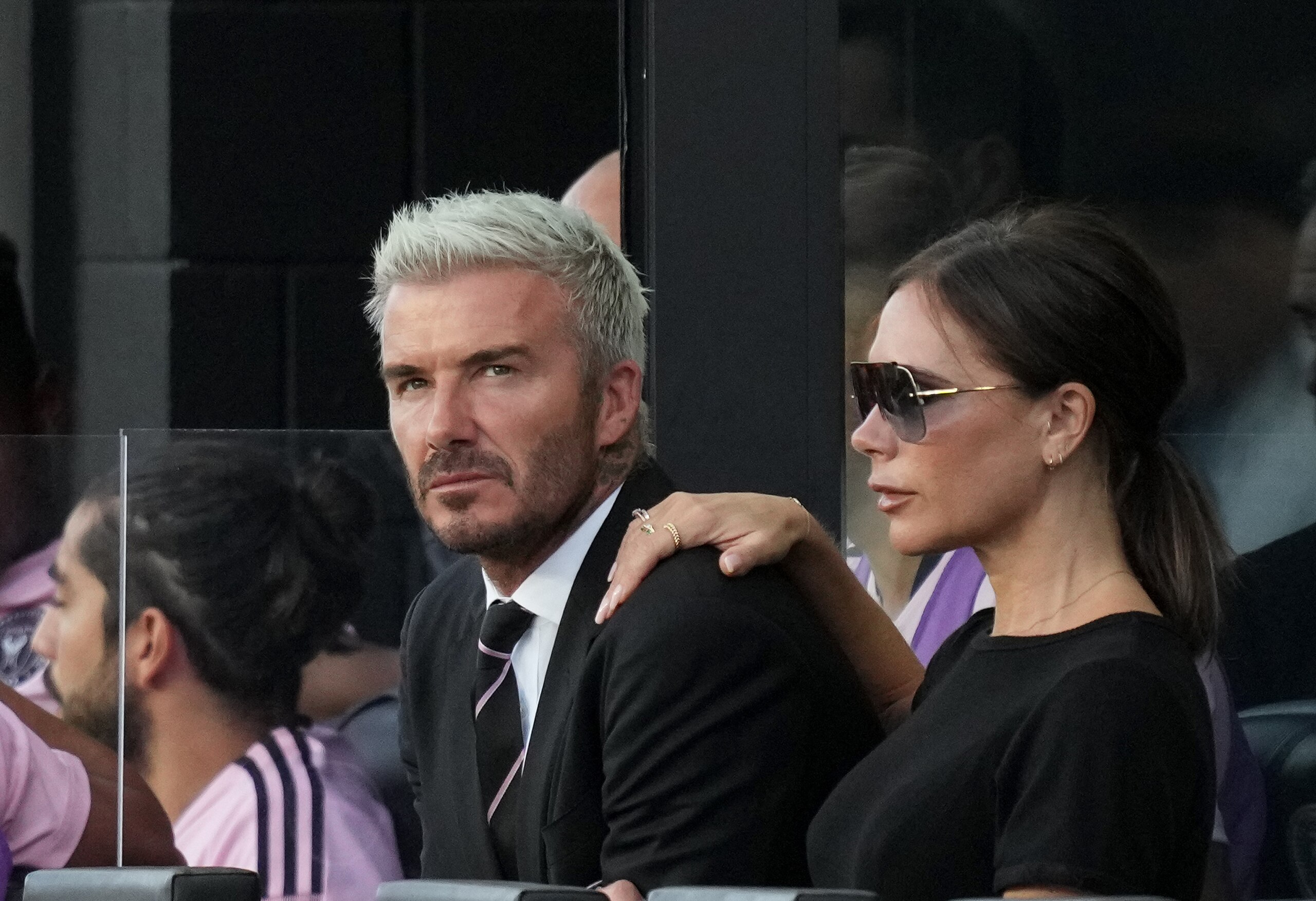 FORT LAUDERDALE, FLORIDA - AUGUST 18: Owner & President of Soccer Operations David Beckham of Inter Miami CF and his wife Victoria Beckham watch the match against Chicago Fire FC during the first half at DRV PNK Stadium on August 18, 2021 in Fort Lauderdale, Florida. (Photo by Mark Brown/Getty Images)