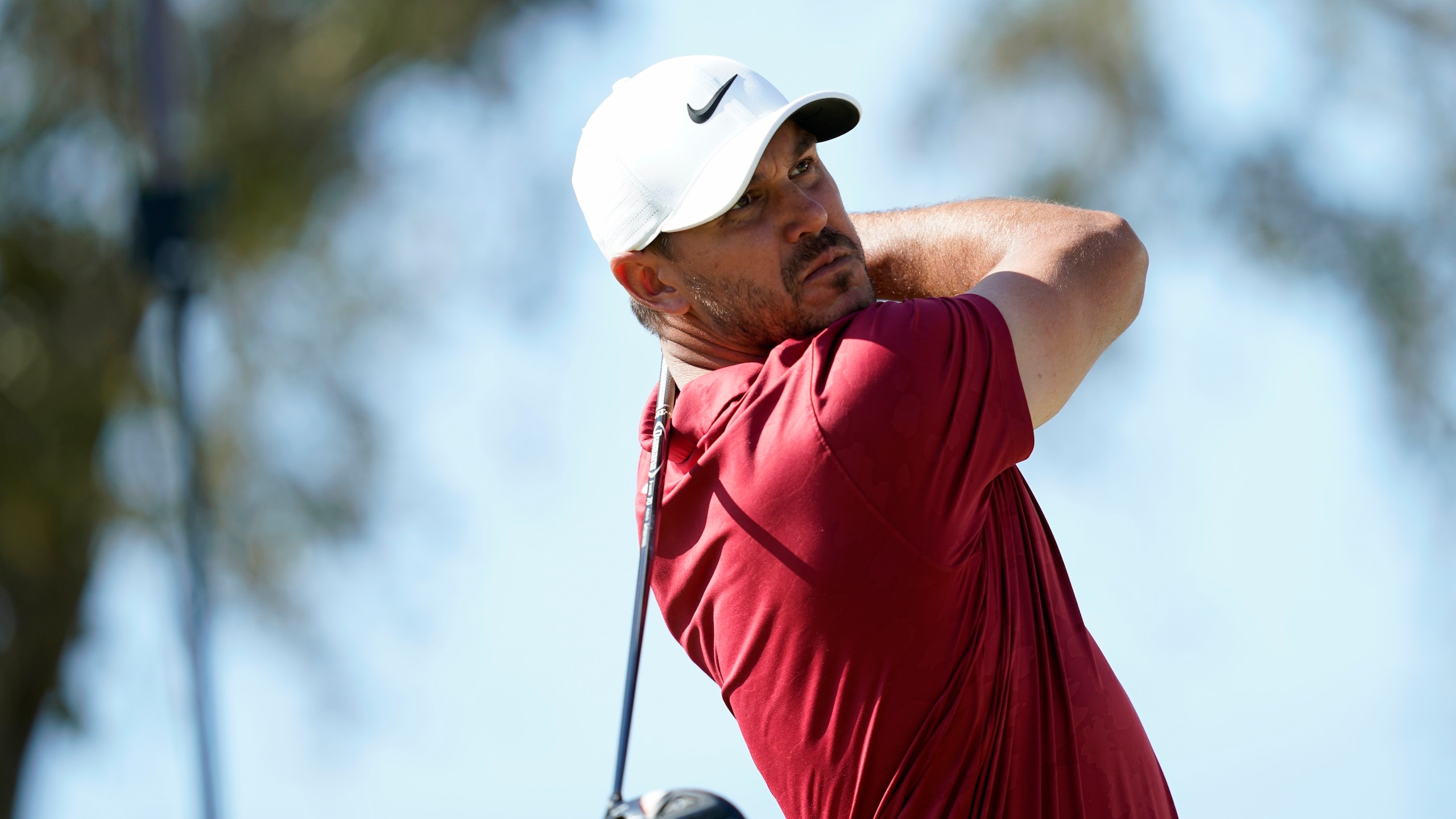 Brooks Koepka tees off from the 12th tee during the Dell Technologies Match Play Championship golf tournament, Saturday, March 26, 2022, in Austin, Texas. (AP Photo/Tony Gutierrez)