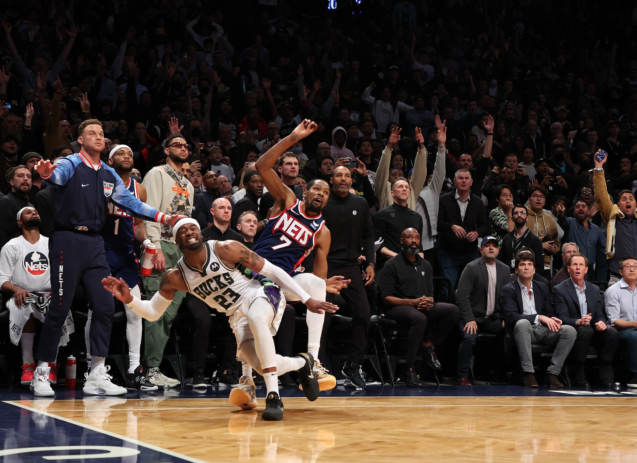 NEW YORK, NEW YORK - MARCH 31:  Kevin Durant #7 of the Brooklyn Nets is fouled by Wesley Matthews #23 of the Milwaukee Bucks in overtime during their game at Barclays Center on March 31, 2022 in New York City.  NOTE TO USER: User expressly acknowledges and agrees that, by downloading and or using this photograph, User is consenting to the terms and conditions of the Getty Images License Agreement.   (Photo by Al Bello/Getty Images)