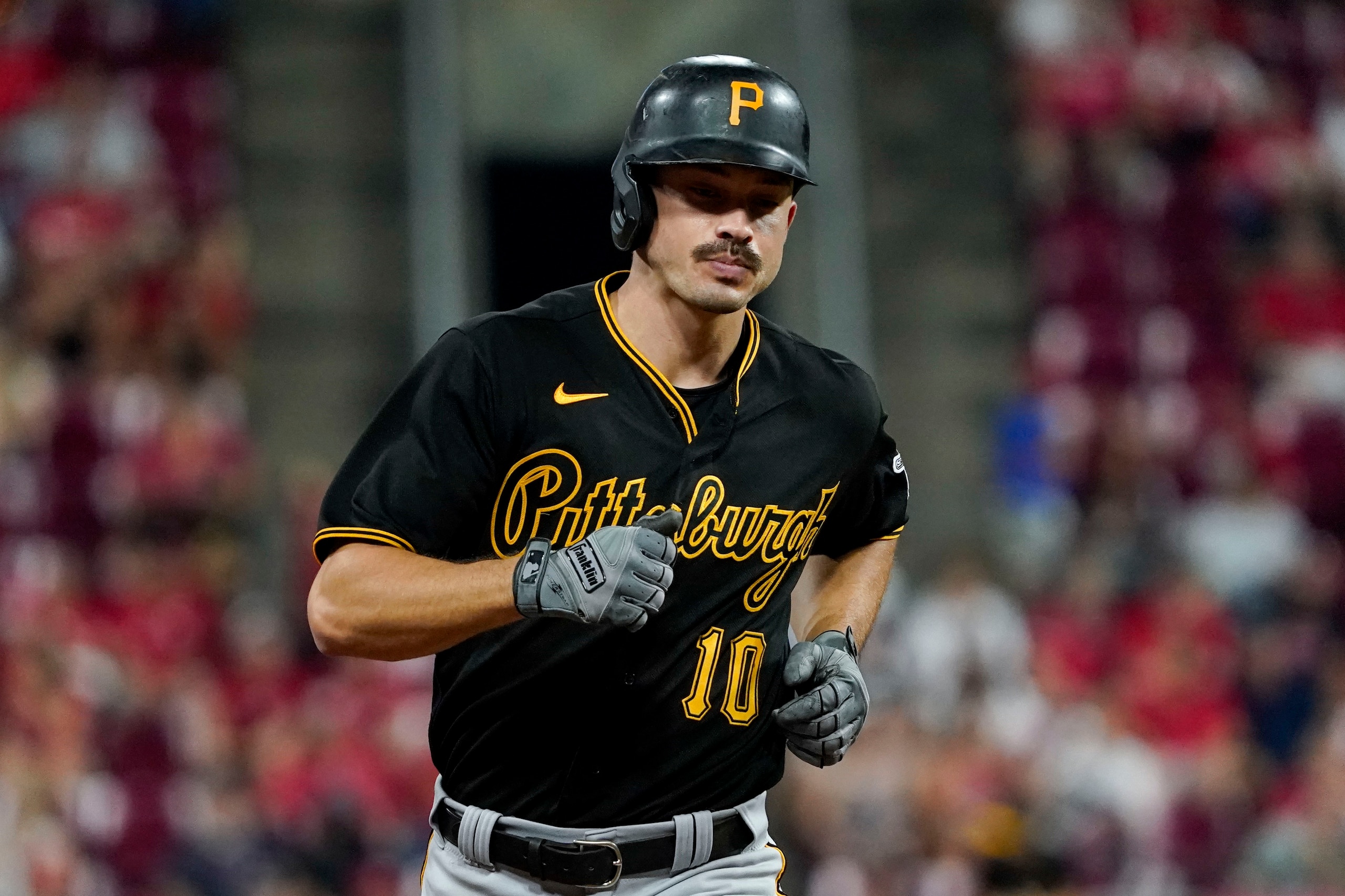 FILE - Pittsburgh Pirates' Bryan Reynolds runs the bases after hitting a two-run home run during the eighth inning of the team's baseball game against the Cincinnati Reds in Cincinnati on Saturday, Aug. 7, 2021. Pirates All-Star outfielder Bryan Reynolds is prepping for what could be a "messy" arbitration battle with his team. Reynolds asked for $4.9 million after coming off his best season. The Pirates countered with $4.25 million. (AP Photo/Jeff Dean, File)