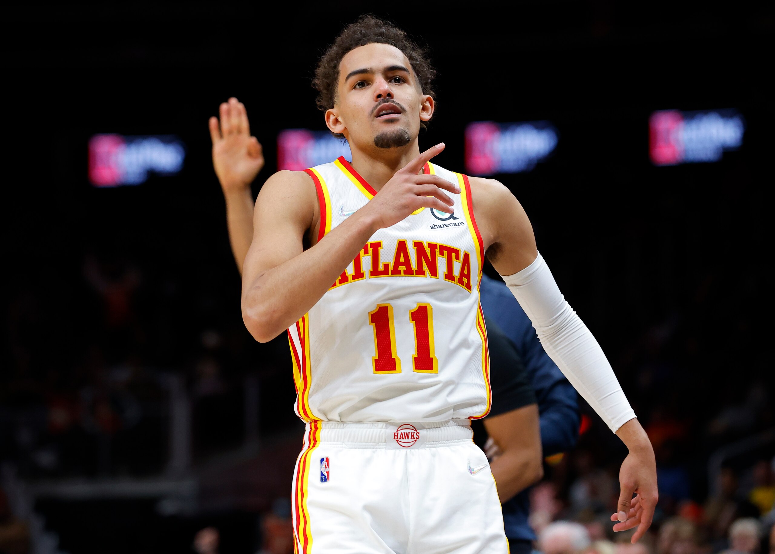 ATLANTA, GA - MARCH 31: Trae Young #11 of the Atlanta Hawks reacts during the second half against the Cleveland Cavaliers at State Farm Arena on March 31, 2022 in Atlanta, Georgia. NOTE TO USER: User expressly acknowledges and agrees that, by downloading and or using this photograph, User is consenting to the terms and conditions of the Getty Images License Agreement. (Photo by Todd Kirkland/Getty Images)