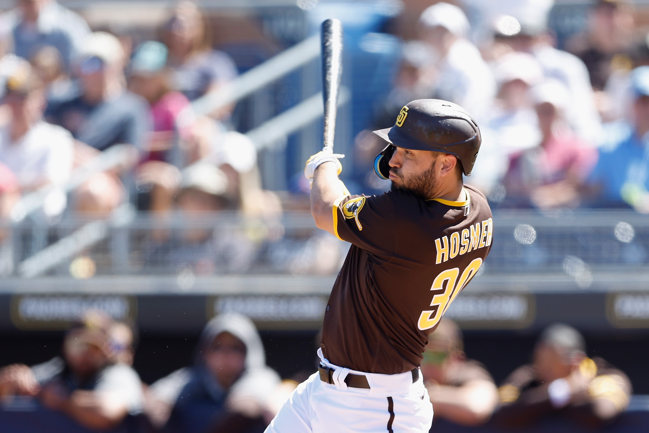 PEORIA, ARIZONA - MARCH 23: Eric Hosmer #30 of the San Diego Padres hits a single against the Los Angeles Angels during the second inning of the MLB spring training game at Peoria Stadium on March 23, 2022 in Peoria, Arizona. (Photo by Christian Petersen/Getty Images)