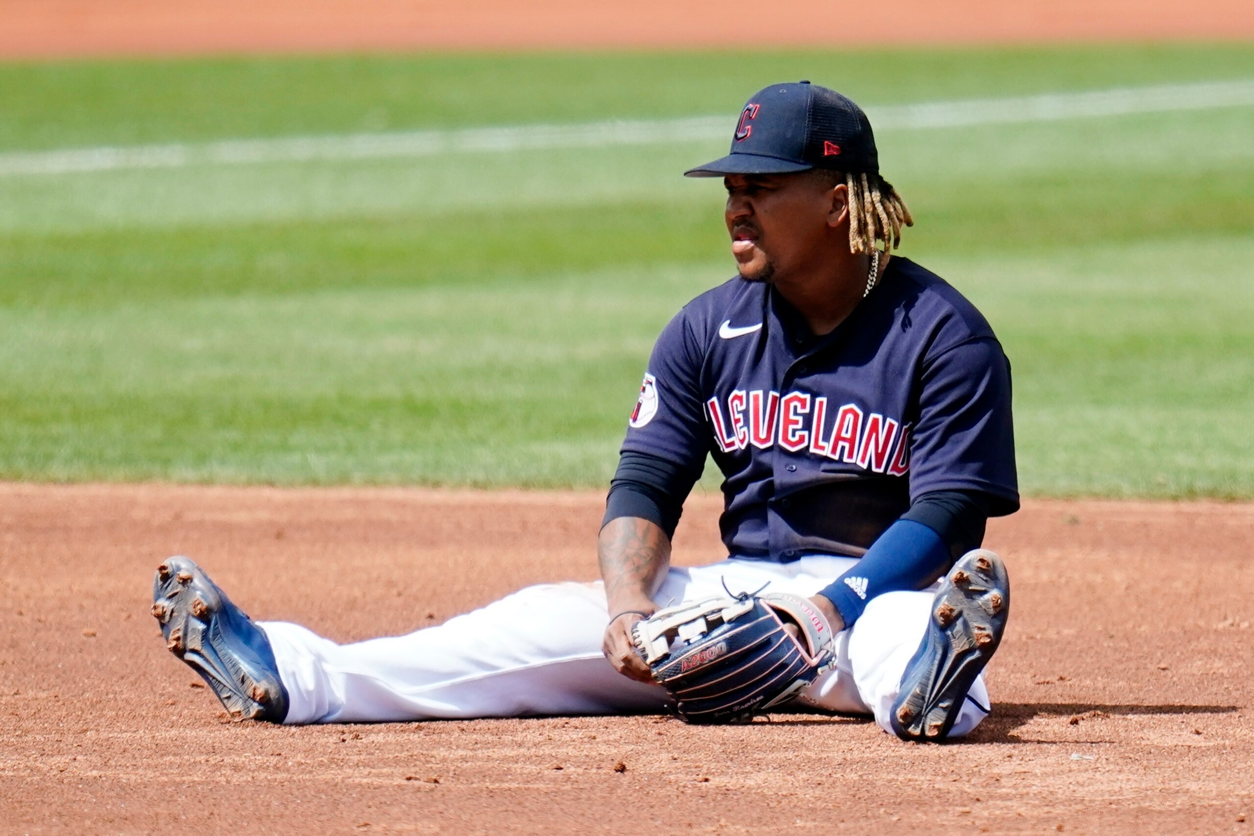 Cleveland Guardians third baseman Jose Ramirez sits on the infield dirt after failing to make a force out at second base against the Milwaukee Brewers during the third inning of a spring training baseball game Tuesday, March 29, 2022, in Goodyear, Ariz. (AP Photo/Ross D. Franklin) Cleveland Guardians third baseman Jose Ramirez sits on the infield dirt after failing to make a force out at second base against the Milwaukee Brewers during the third inning of a spring training baseball game Tuesday, March 29, 2022, in Goodyear, Ariz. (AP Photo/Ross D. Franklin)