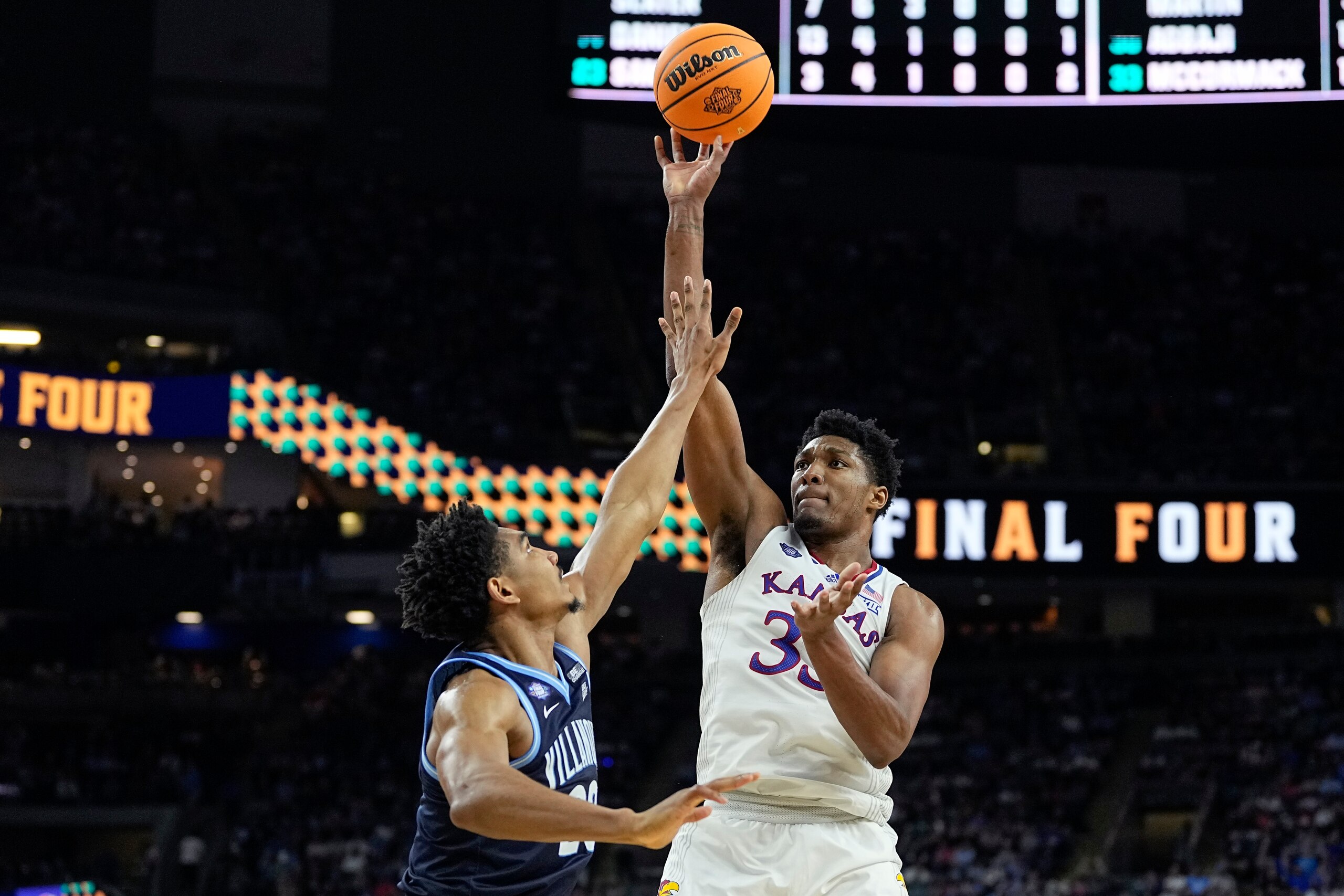 Kansas forward David McCormack (33) shoots over Villanova's Jermaine Samuels during the second half of a college basketball game in the semifinal round of the Men's Final Four NCAA tournament, Saturday, April 2, 2022, in New Orleans. (AP Photo/David J. Phillip) Kansas forward David McCormack (33) shoots over Villanova's Jermaine Samuels during the second half of a college basketball game in the semifinal round of the Men's Final Four NCAA tournament, Saturday, April 2, 2022, in New Orleans. (AP Photo/David J. Phillip)