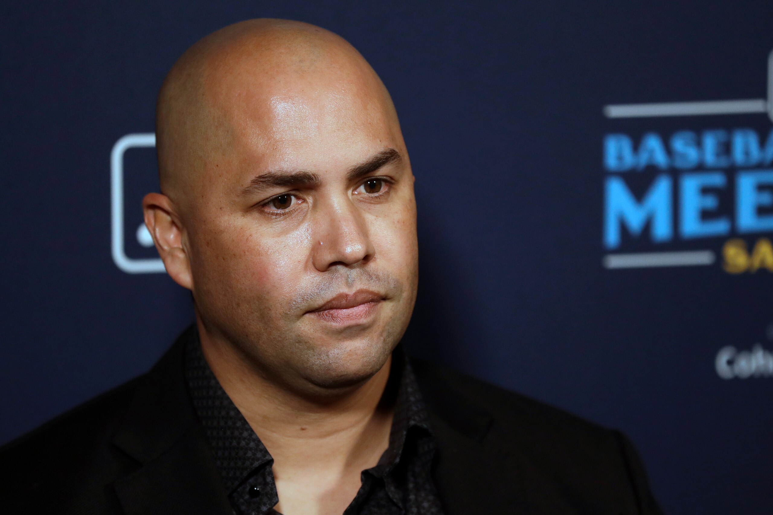FILE - New York Mets manager Carlos Beltran listens to a question during the Major League Baseball winter meetings, Tuesday, Dec. 10, 2019, in San Diego. With Barry Bonds, Roger Clemens and Curt Schilling off the ballot, next year’s Hall of Fame vote figures to be a bit less contentious. Then again, the top newcomer arrives with his own recent baggage. Carlos Beltrán is eligible for the Hall of Fame in 2023, and although the sweet-swinging outfielder had a distinguished career at the plate and in the field, he was also implicated in the Houston Astros’ sign-stealing scandal. (AP Photo/Gregory Bull, File)