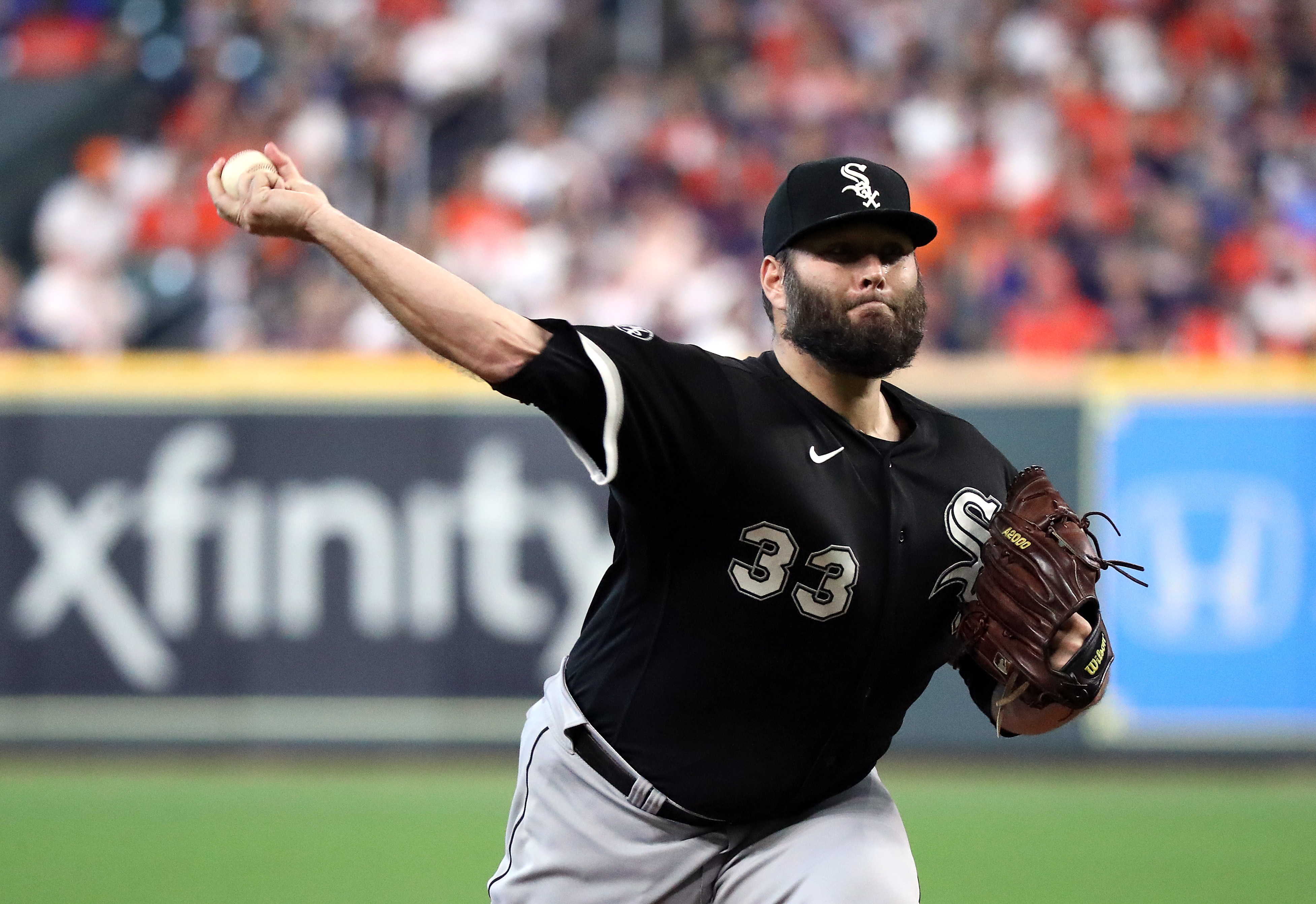 HOUSTON, TEXAS - OCTOBER 07:  Starting pitcher Lance Lynn #33 of the Chicago White Sox pitches during the 1st inning of Game 1 of the American League Division Series against the Houston Astros at Minute Maid Park on October 07, 2021 in Houston, Texas. (Photo by Bob Levey/Getty Images)