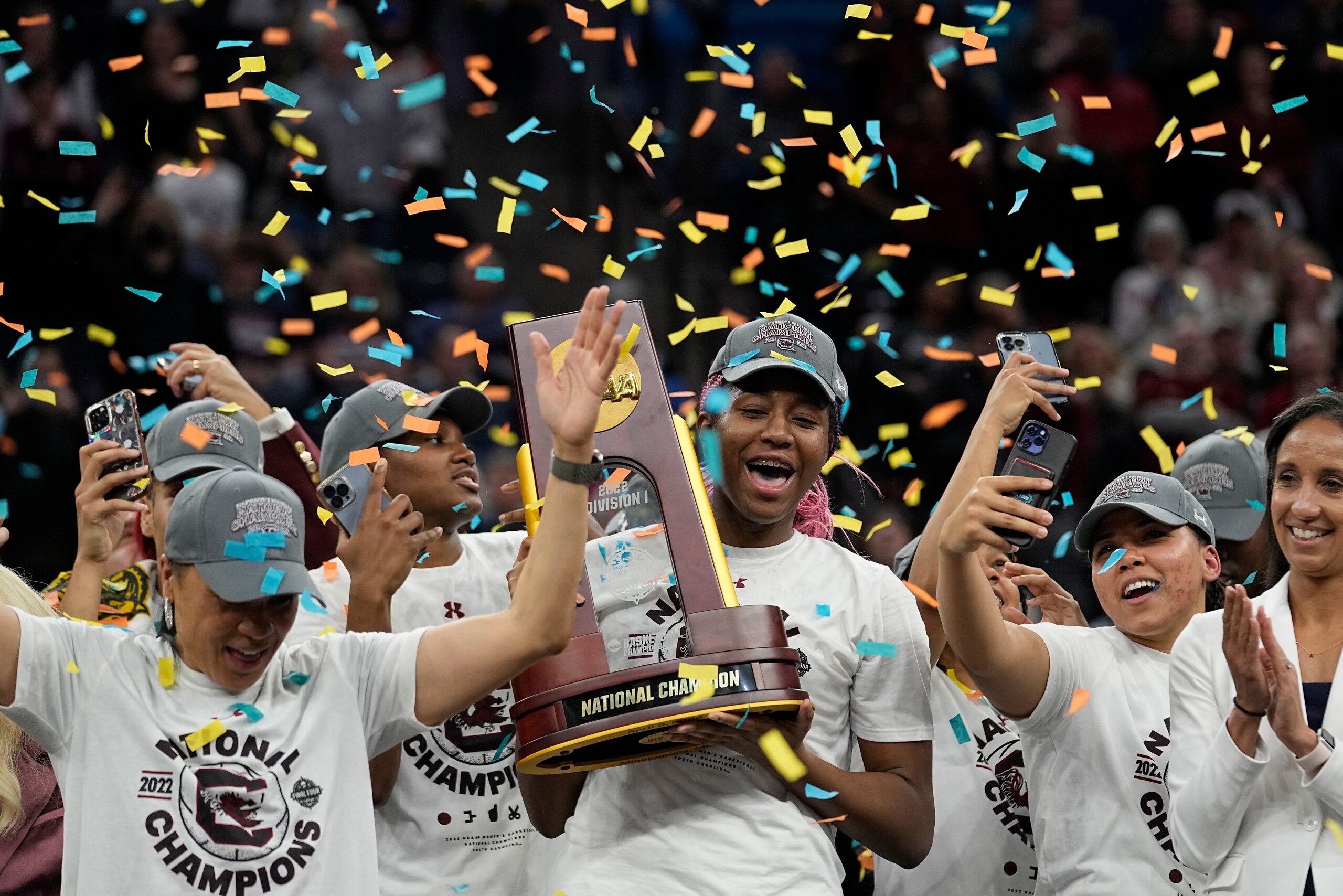 South Carolina's Aliyah Boston holds the trophy after a college basketball game in the final round of the Women's Final Four NCAA tournament against UConn Sunday, April 3, 2022, in Minneapolis. South Carolina won 64-49 to win the championship. (AP Photo/Eric Gay)