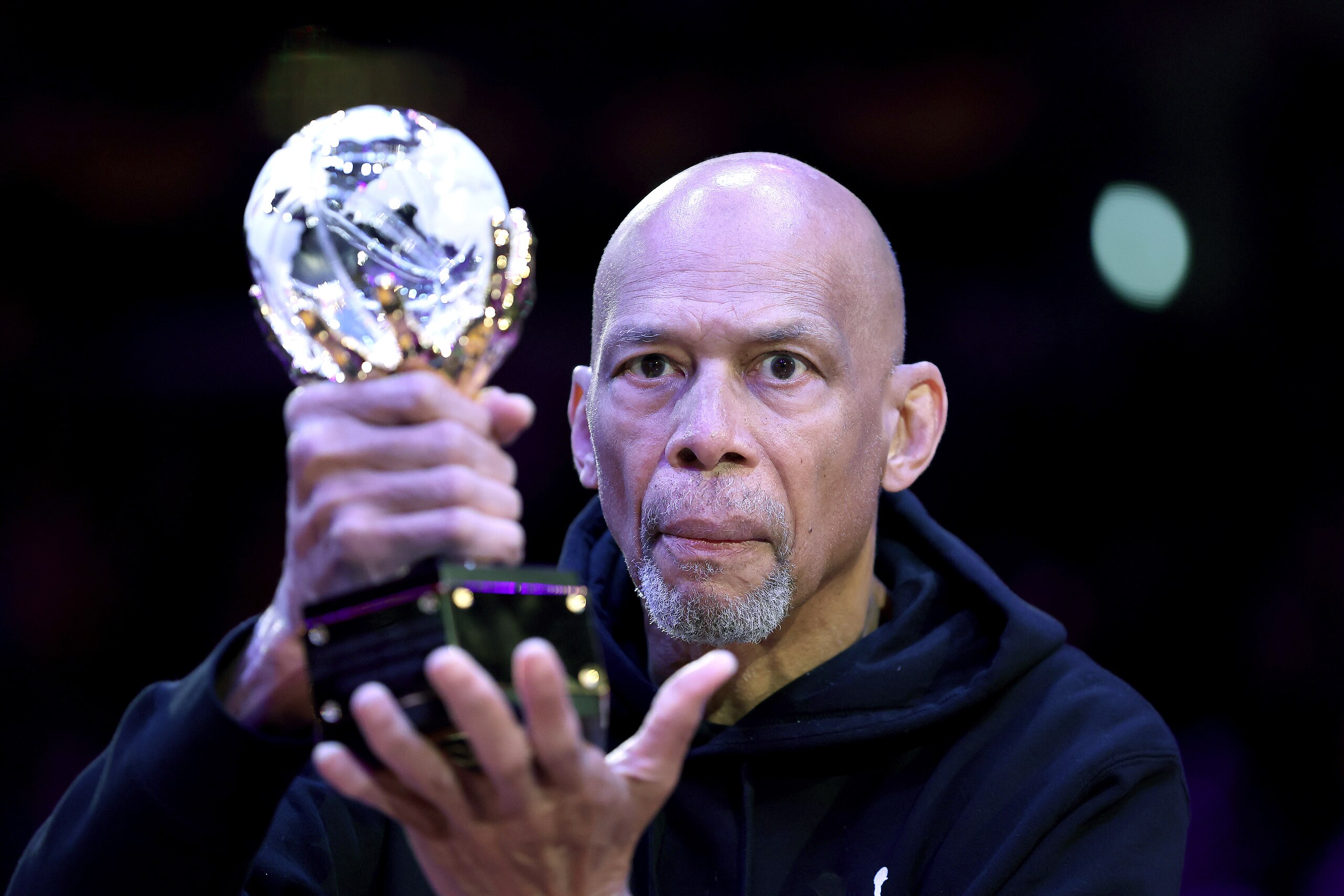 LOS ANGELES, CALIFORNIA - APRIL 03: Retired basketball player Kareem Abdul-Jabbar holds the trophy for the league’s annual Social Justice Champion award prior to a game between the Los Angeles Lakers and the Denver Nuggets at Crypto.com Arena on April 03, 2022 in Los Angeles, California. NOTE TO USER: User expressly acknowledges and agrees that, by downloading and/or using this Photograph, user is consenting to the terms and conditions of the Getty Images License Agreement. Mandatory Copyright Notice: Copyright 2022 NBAE (Photo by Sean M. Haffey/Getty Images)