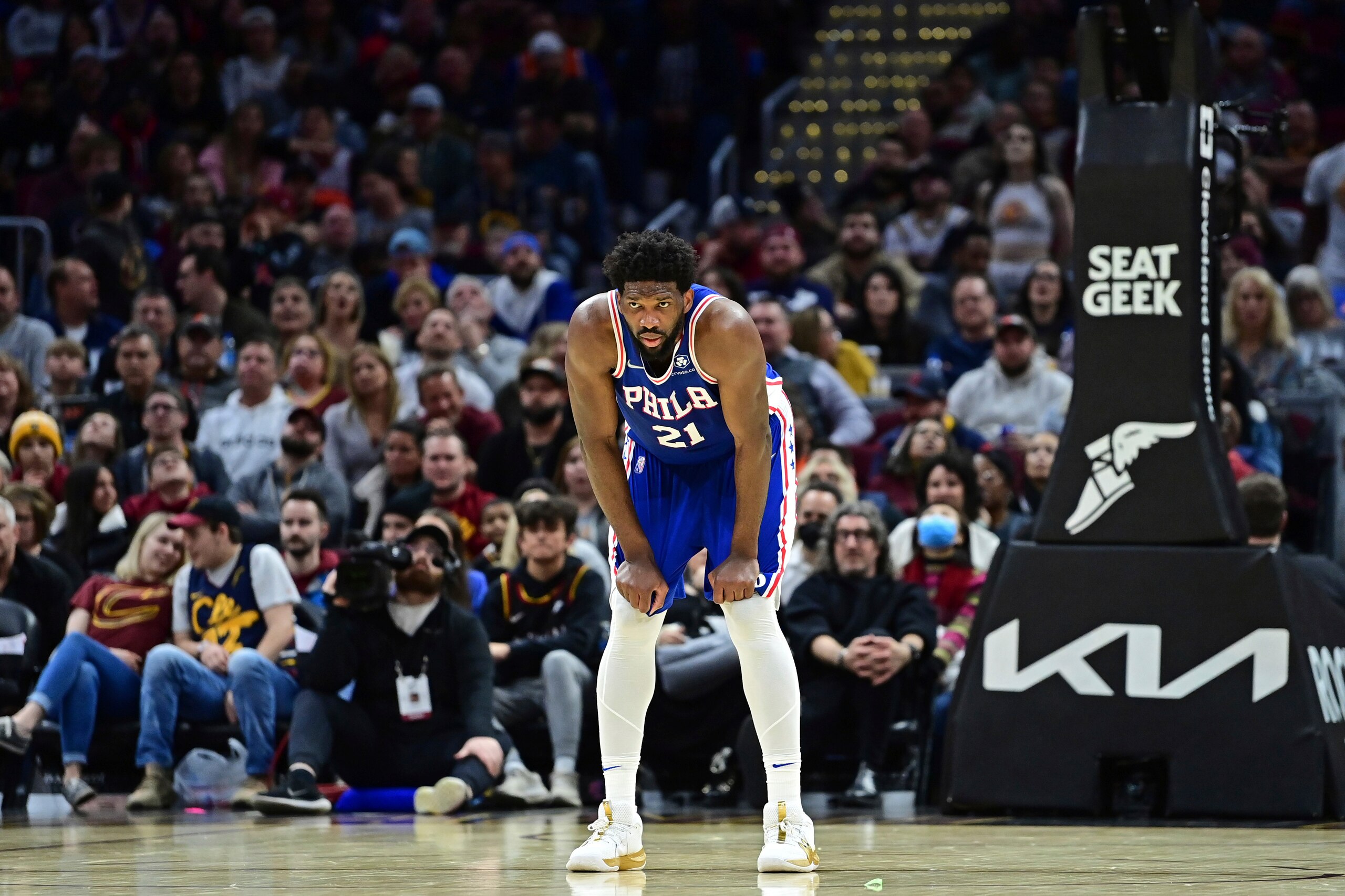 Philadelphia 76ers center Joel Embiid stands in the second half of an NBA basketball game against the Cleveland Cavaliers, Sunday, April 3, 2022, in Cleveland. The 76ers won 112-108. (AP Photo/David Dermer)