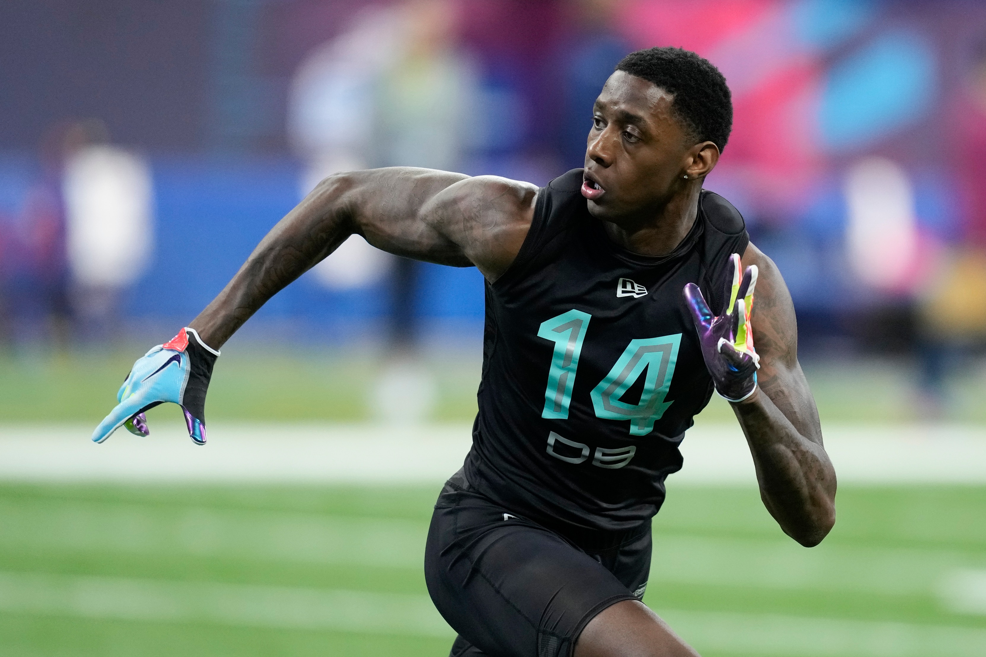 Cincinnati defensive back Sauce Gardner participates in a drill at the NFL football scouting combine, Sunday, March 6, 2022, in Indianapolis. (AP Photo/Charlie Neibergall)