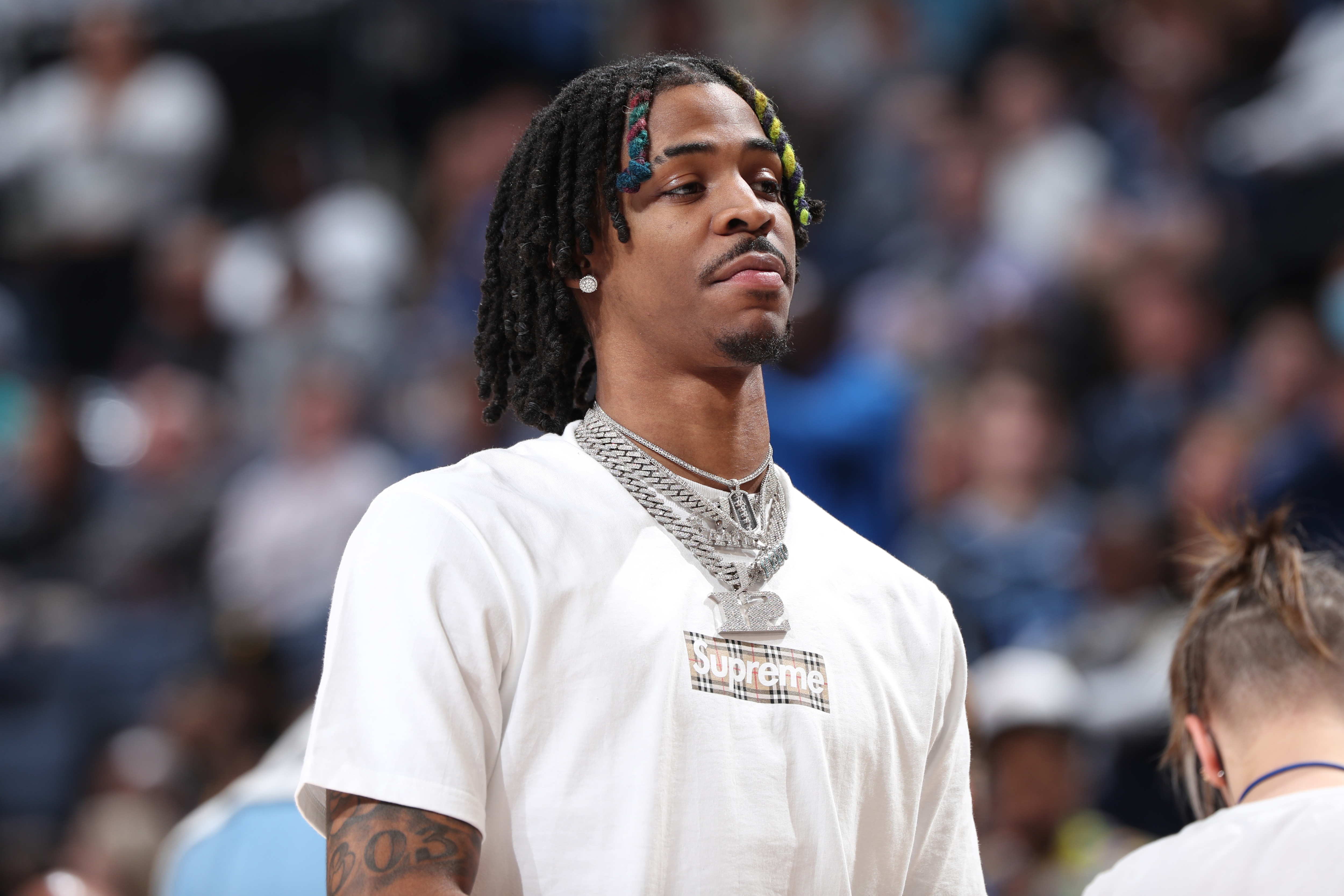 MEMPHIS, TN - MARCH 28: Ja Morant #12 of the Memphis Grizzlies looks on during the game against the Golden State Warriors on March 28, 2022 at FedExForum in Memphis, Tennessee. NOTE TO USER: User expressly acknowledges and agrees that, by downloading and or using this photograph, User is consenting to the terms and conditions of the Getty Images License Agreement. Mandatory Copyright Notice: Copyright 2022 NBAE (Photo by Joe Murphy/NBAE via Getty Images)