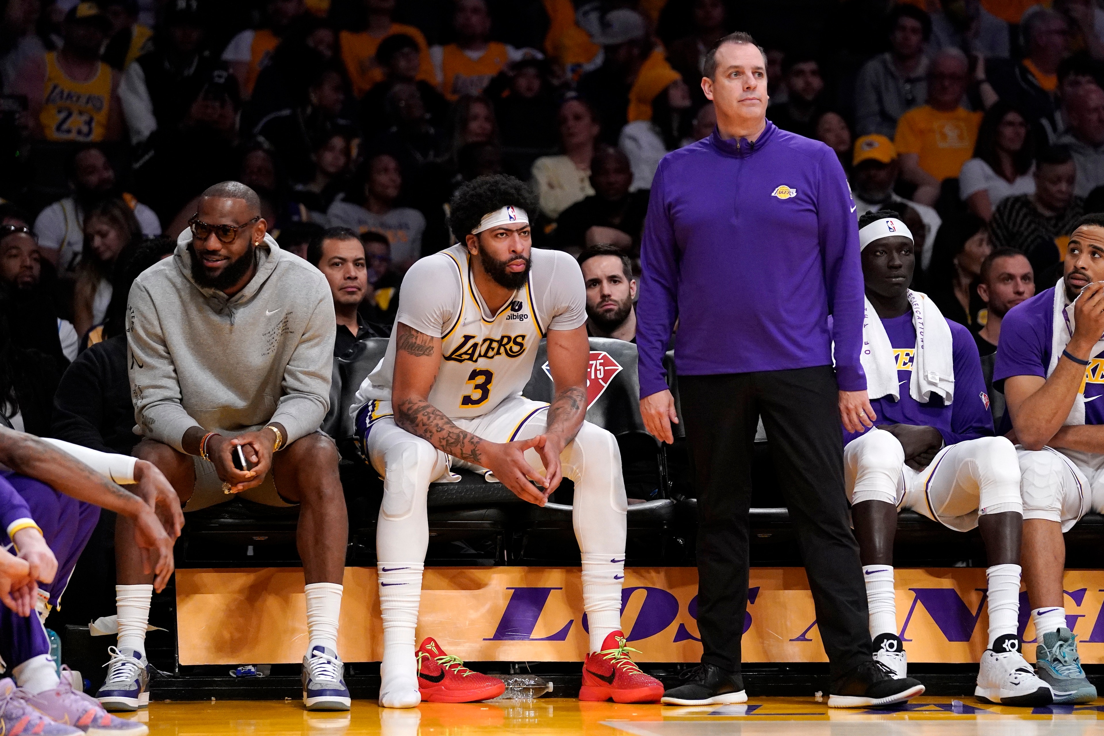 Los Angeles Lakers forward LeBron James, left, sits on the Bech next to forward Anthony Davis as head coach Frank Vogel stands by during the second half of an NBA basketball game against the Denver Nuggets Sunday, April 3, 2022, in Los Angeles. (AP Photo/Mark J. Terrill) Los Angeles Lakers forward LeBron James, left, sits on the Bech next to forward Anthony Davis as head coach Frank Vogel stands by during the second half of an NBA basketball game against the Denver Nuggets Sunday, April 3, 2022, in Los Angeles. (AP Photo/Mark J. Terrill)