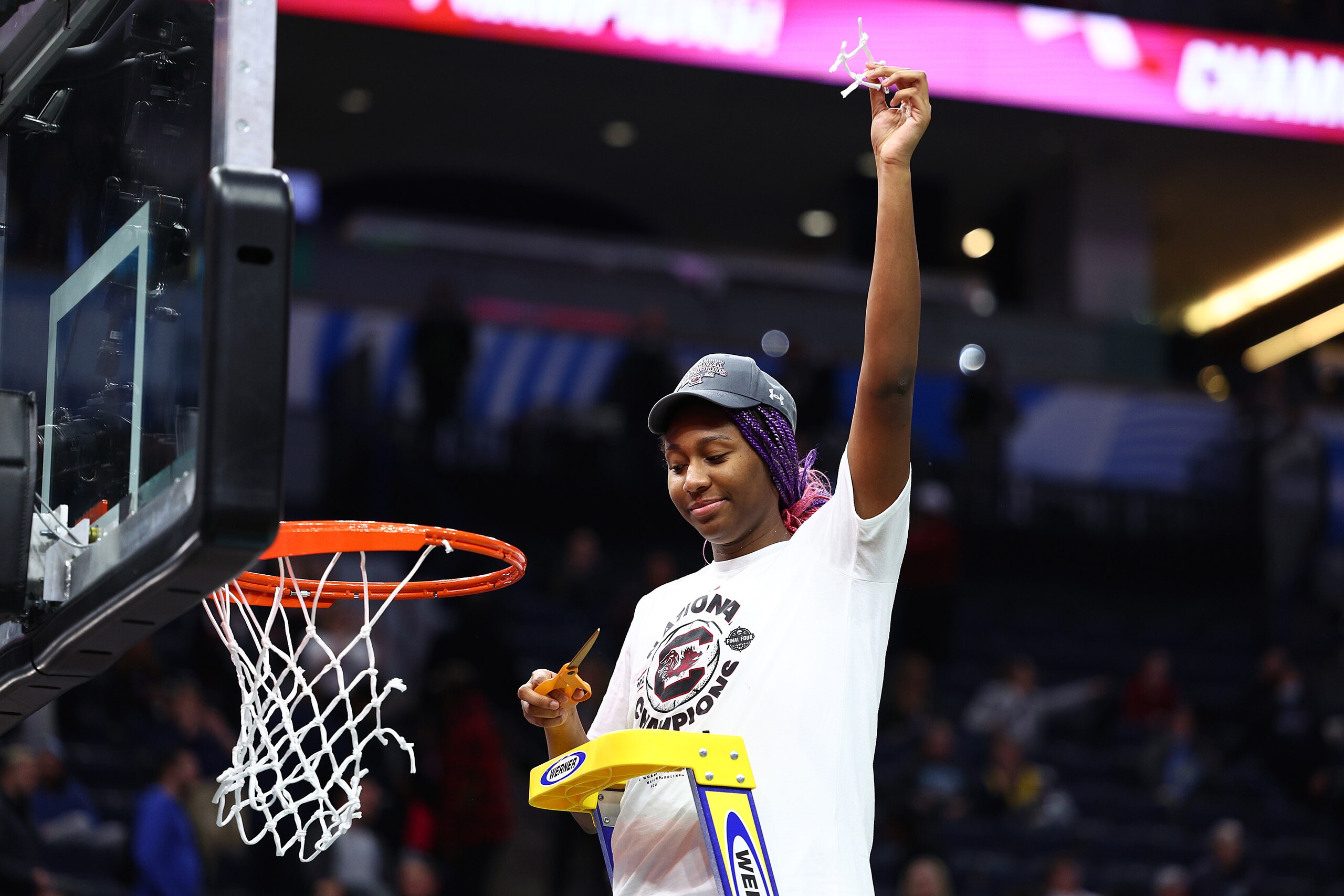 MINNEAPOLIS, MINNESOTA - APRIL 03: Aliyah Boston #4 of the South Carolina Gamecocks poses after cutting down a piece of the net after defeating the UConn Huskies 64-49 during the 2022 NCAA Women's Basketball Tournament National Championship game at Target Center on April 03, 2022 in Minneapolis, Minnesota. (Photo by Elsa/Getty Images) MINNEAPOLIS, MINNESOTA - APRIL 03: Aliyah Boston #4 of the South Carolina Gamecocks poses after cutting down a piece of the net after defeating the UConn Huskies 64-49 during the 2022 NCAA Women's Basketball Tournament National Championship game at Target Center on April 03, 2022 in Minneapolis, Minnesota. (Photo by Elsa/Getty Images)