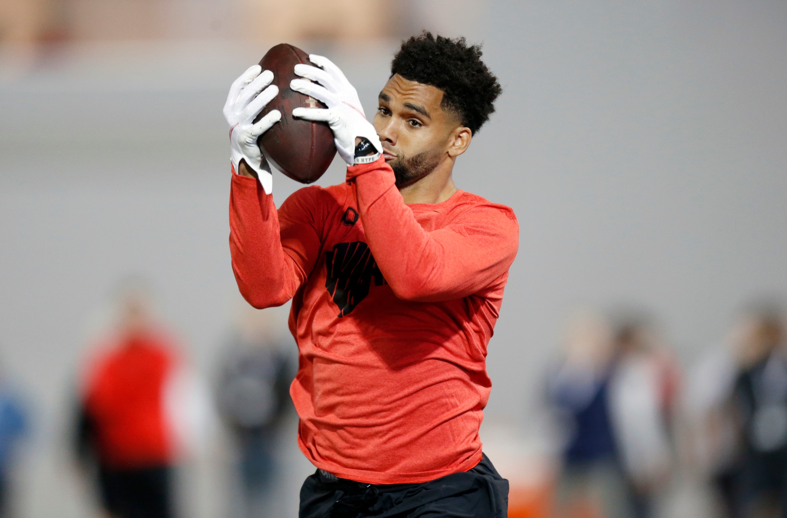 Wide receiver Chris Olave runs a football drill during Ohio State Pro Day in Columbus, Ohio, Wednesday, March 23, 2022. (AP Photo/Paul Vernon)