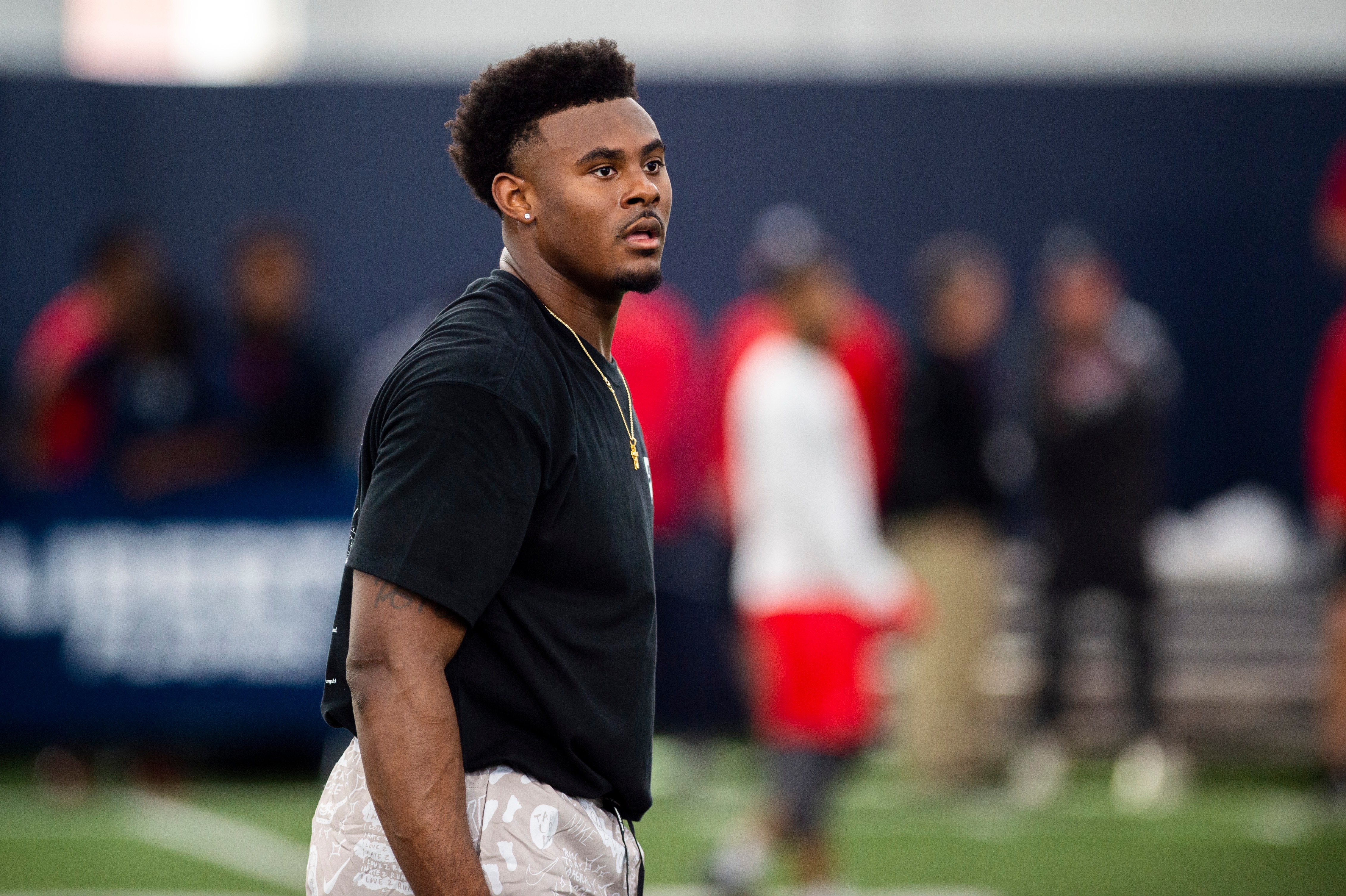 Liberty quarterback Malik Willis stands in between passing drills during Liberty Football Pro Day in Lynchburg, Va., on Tuesday, March 22, 2022. (AP Photo/Kendall Warner)