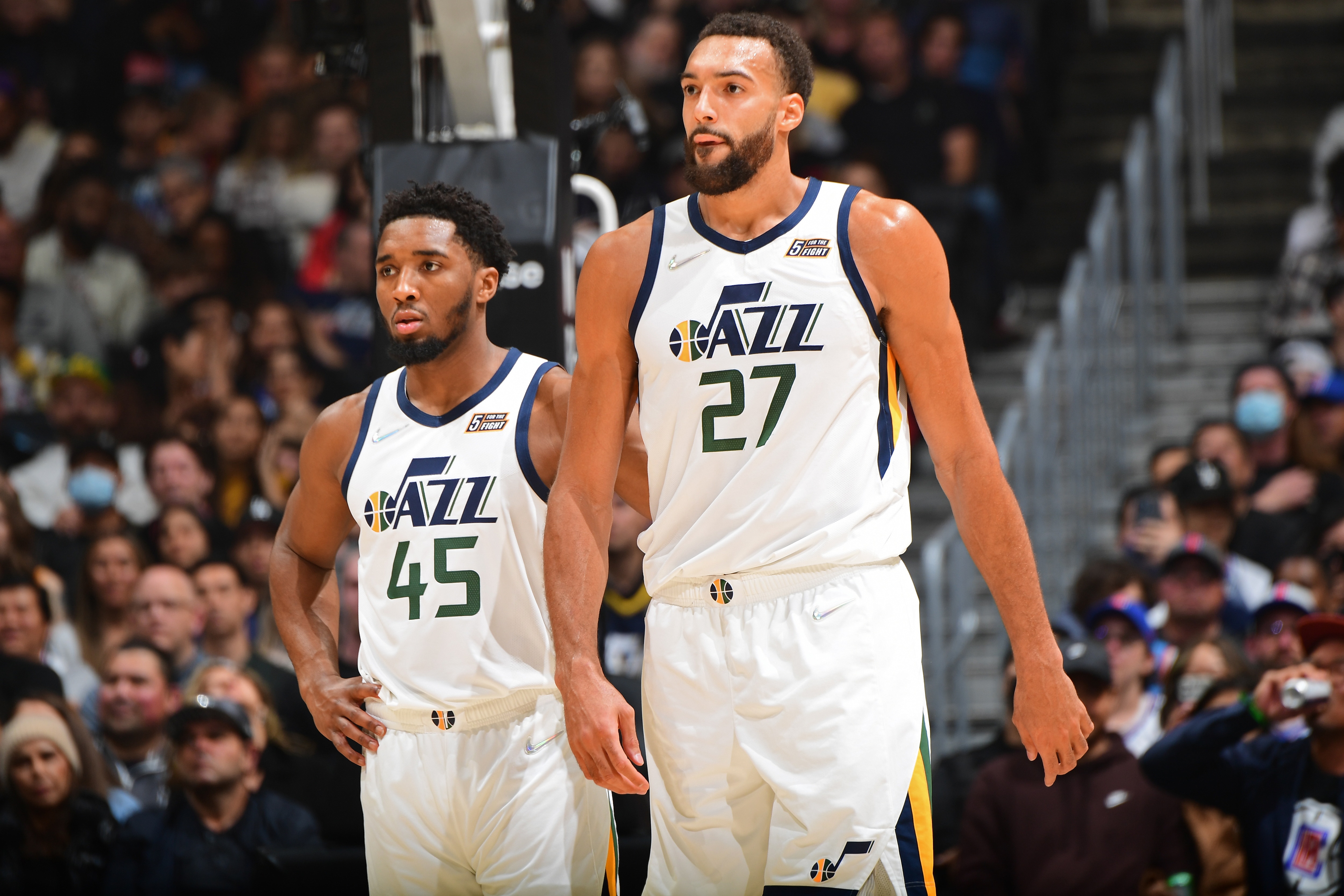 LOS ANGELES, CA - MARCH 29: Donovan Mitchell #45 and Rudy Gobert #27 of the Utah Jazz looks on during the game against the LA Clippers on March 29, 2022 at Crypto.Com Arena in Los Angeles, California. NOTE TO USER: User expressly acknowledges and agrees that, by downloading and/or using this Photograph, user is consenting to the terms and conditions of the Getty Images License Agreement. Mandatory Copyright Notice: Copyright 2022 NBAE (Photo by Adam Pantozzi/NBAE via Getty Images)