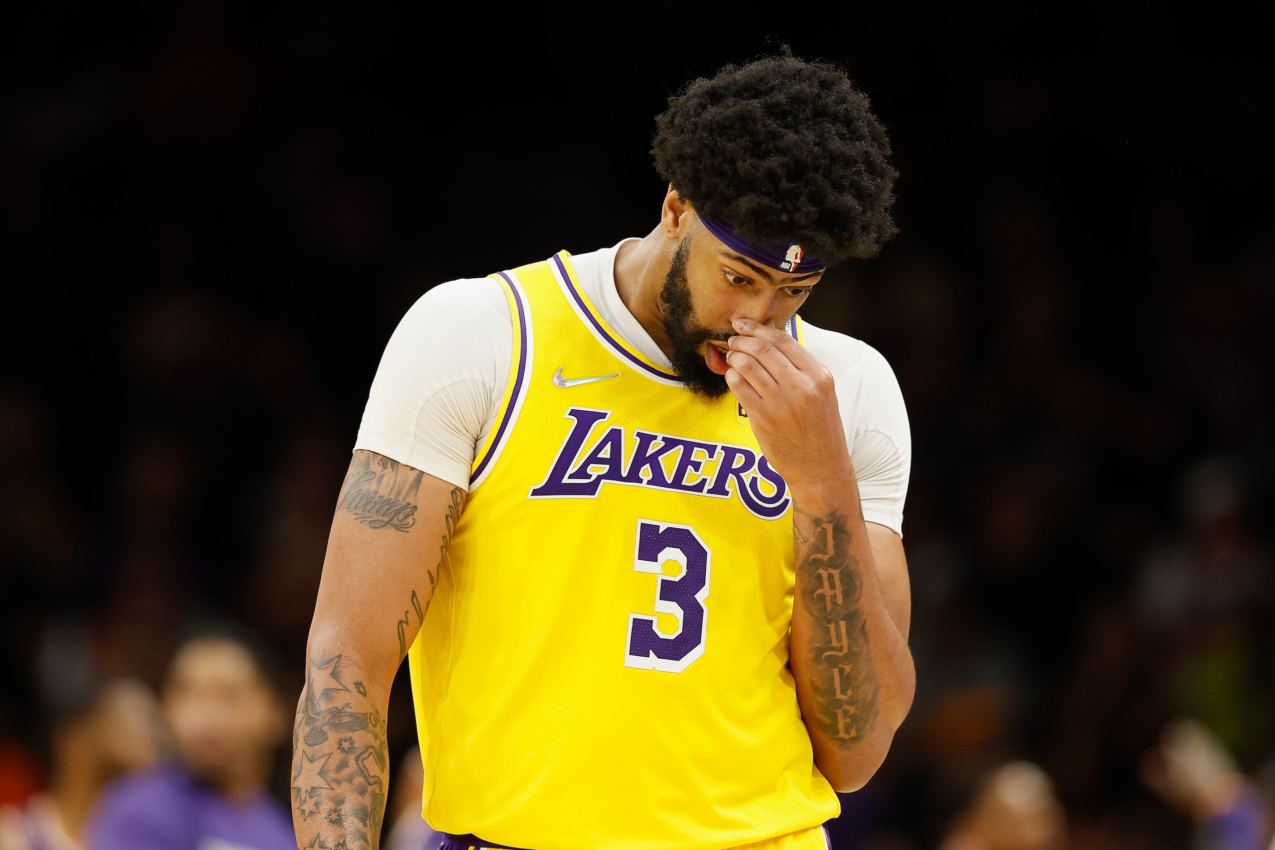 PHOENIX, ARIZONA - APRIL 05: Anthony Davis #3 of the Los Angeles Lakers walks to the bench during the second half of the NBA game against the Phoenix Suns at Footprint Center on April 05, 2022 in Phoenix, Arizona.  The Suns defeated the Lakers 121-110. NOTE TO USER: User expressly acknowledges and agrees that, by downloading and or using this photograph, User is consenting to the terms and conditions of the Getty Images License Agreement. (Photo by Christian Petersen/Getty Images)
