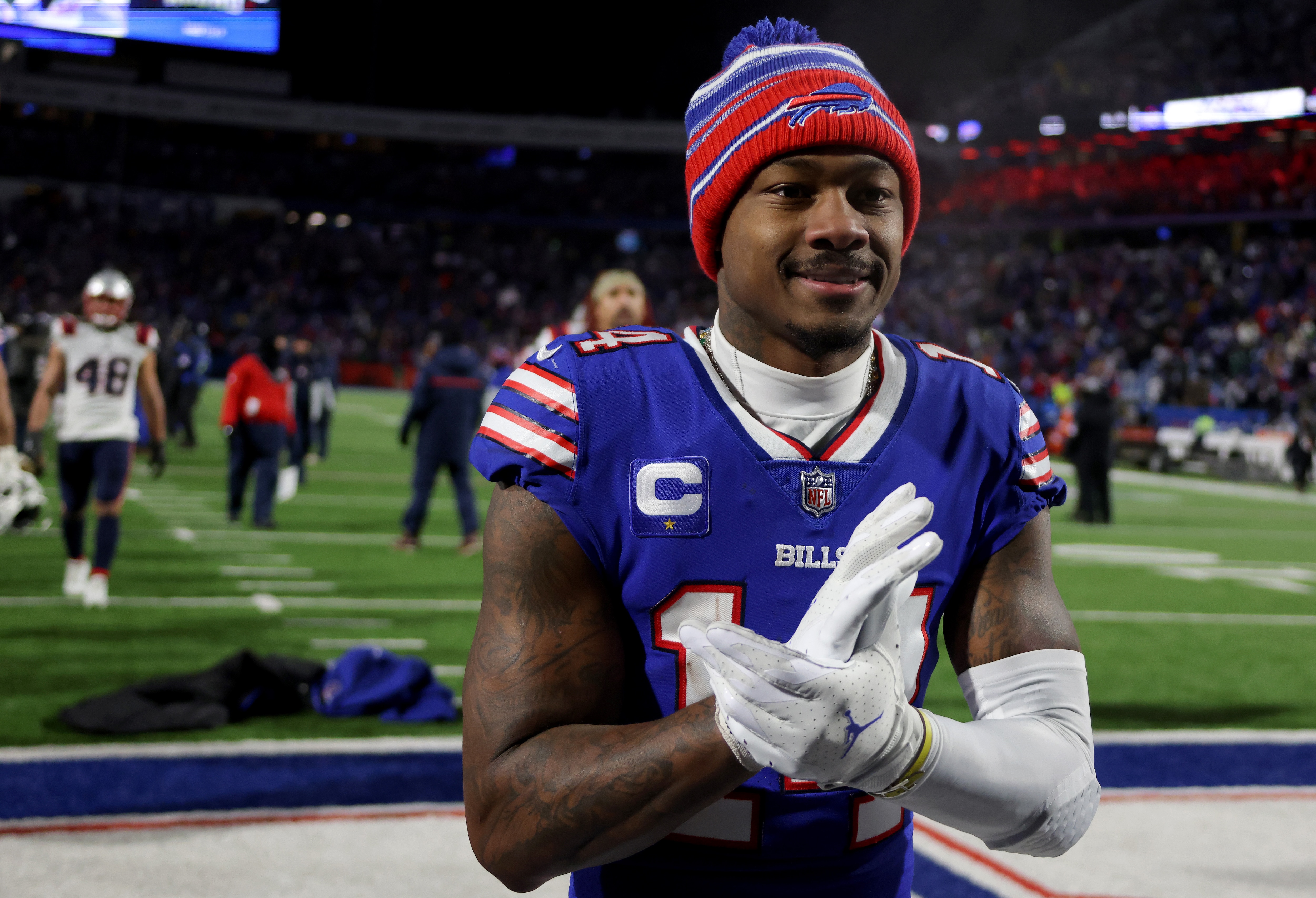 BUFFALO, NEW YORK - JANUARY 15: Stefon Diggs #14 of the Buffalo Bills celebrates after defeating the New England Patriots in the AFC Wild Card playoff game at Highmark Stadium on January 15, 2022 in Buffalo, New York. (Photo by Timothy T Ludwig/Getty Images)