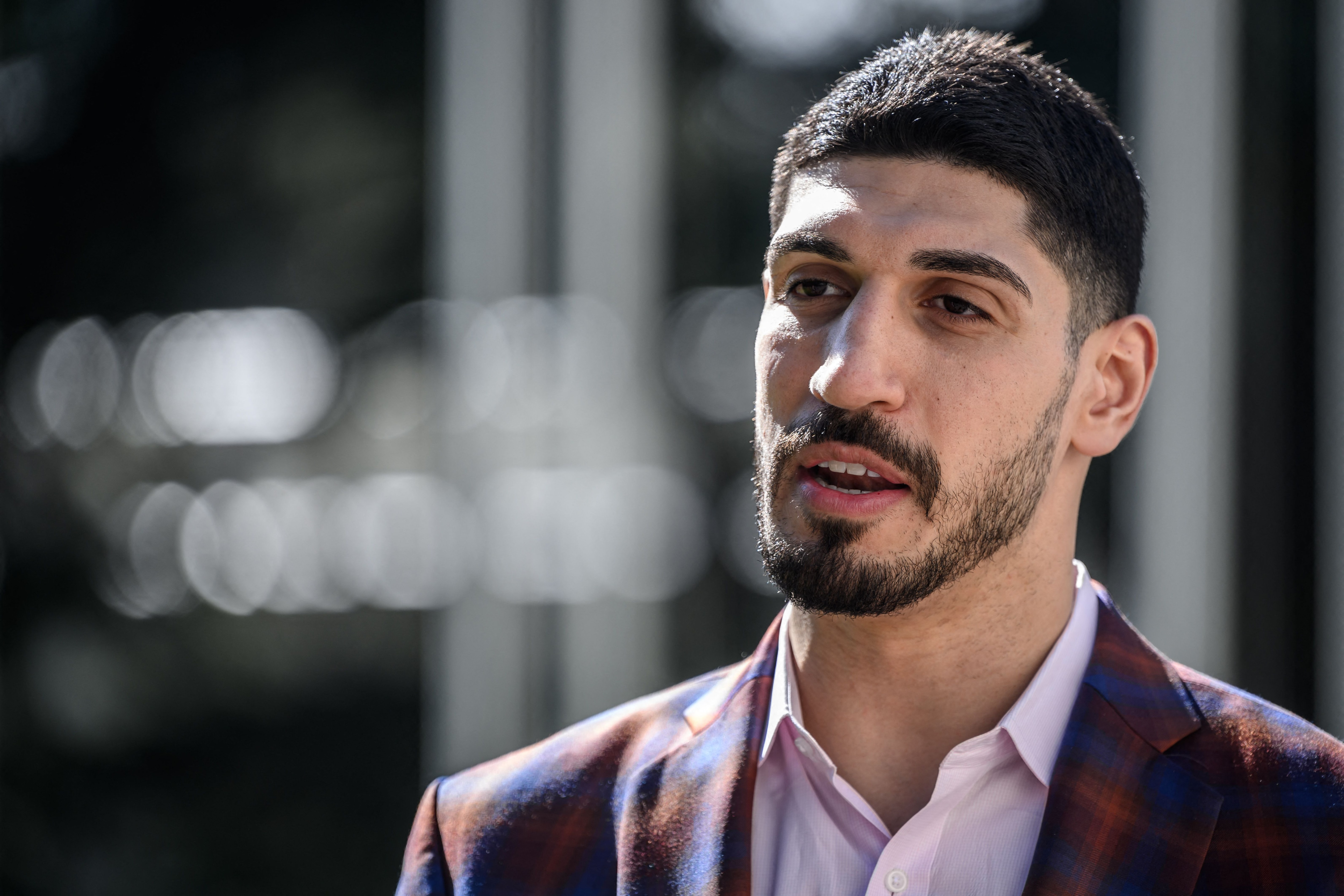 American basketball player Enes Kanter Freedom speaks during an interview with AFP at the United Nations Office in Geneva on April 5, 2022. - Enes Kanter Freedom, whose human rights advocacy has ruffled feathers, hopes to bend UN human rights chief Michelle Bachelet's ear on Thursday about her forthcoming China visit. (Photo by Fabrice COFFRINI / AFP) (Photo by FABRICE COFFRINI/AFP via Getty Images)