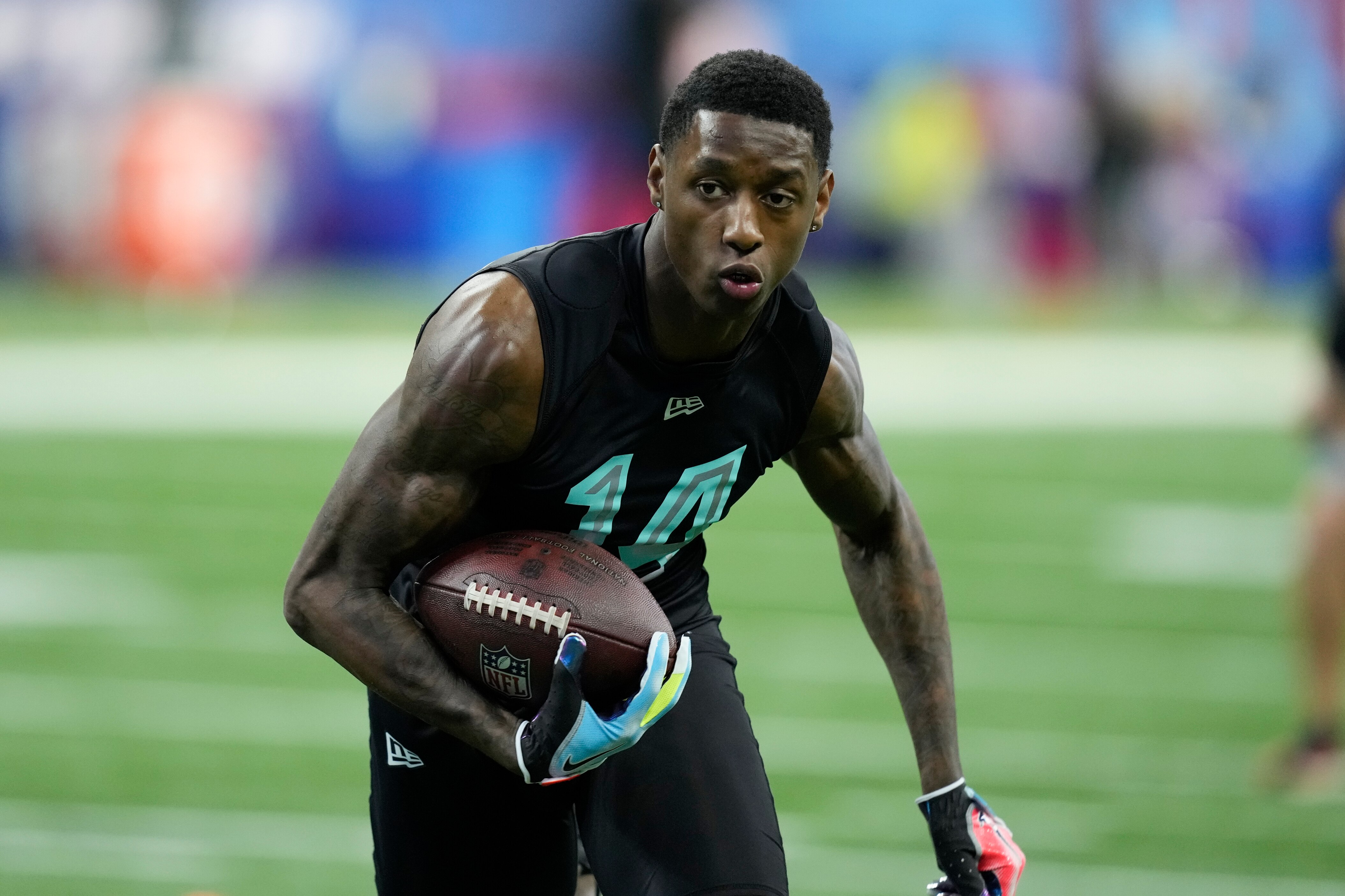 Cincinnati defensive back Sauce Gardner participates in a drill at the NFL football scouting combine, Sunday, March 6, 2022, in Indianapolis. (AP Photo/Charlie Neibergall)