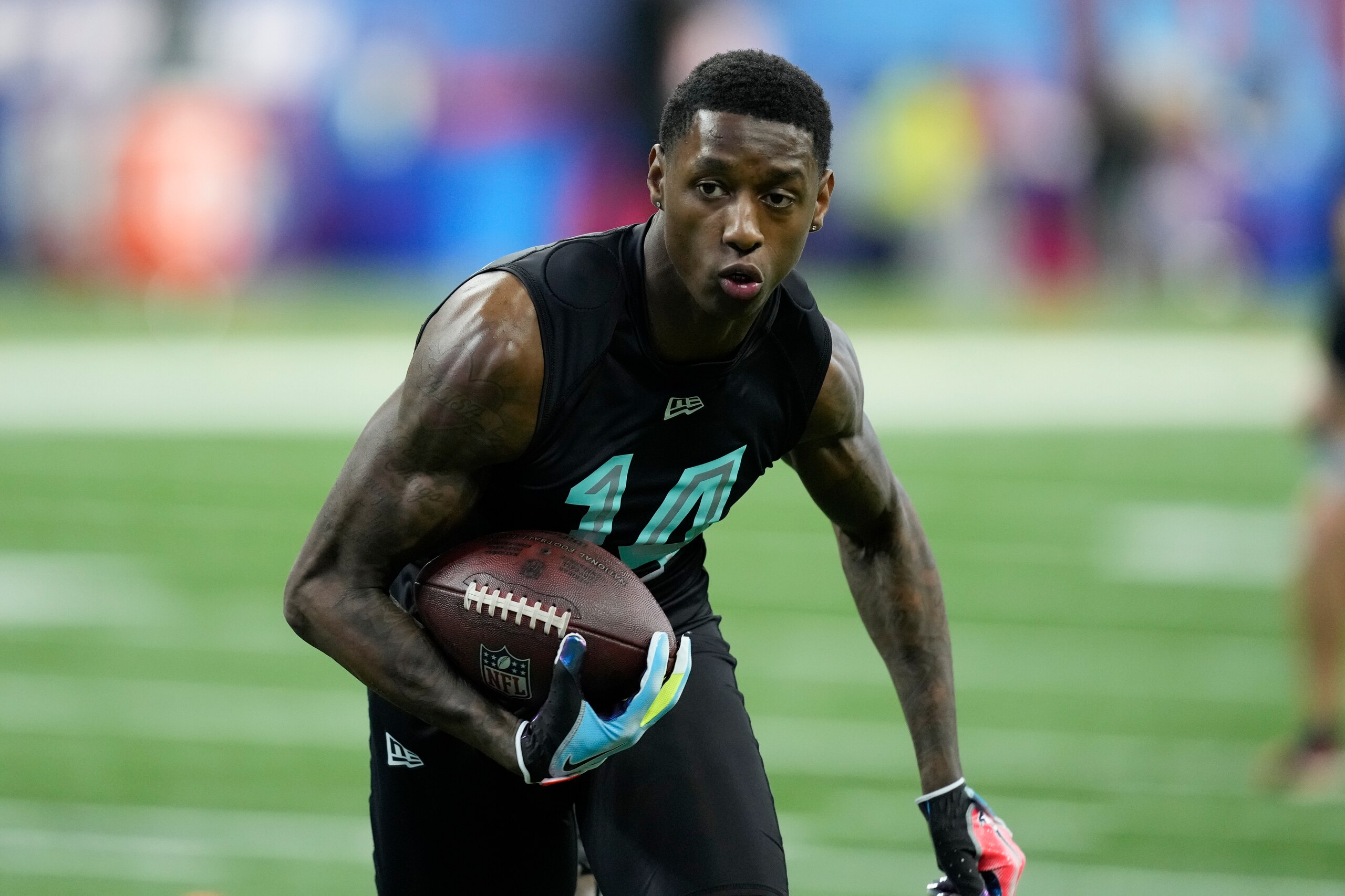 Cincinnati defensive back Sauce Gardner participates in a drill at the NFL football scouting combine, Sunday, March 6, 2022, in Indianapolis. (AP Photo/Charlie Neibergall)