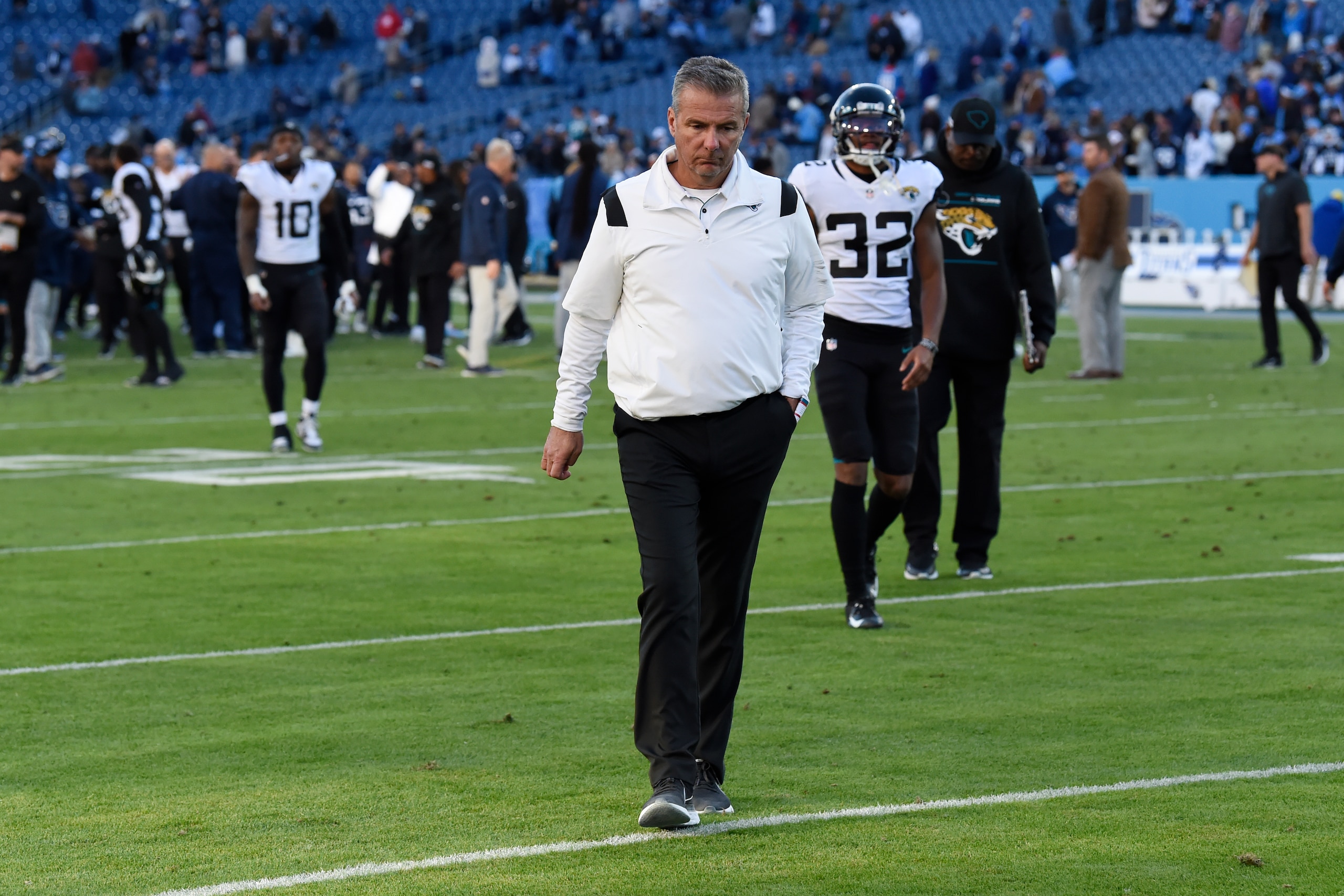 Jacksonville Jaguars head coach Urban Meyer walks off the field after an NFL football game against the Tennessee Titans , Sunday, Dec. 12, 2021, in Nashville, Tenn. The Tennessee Titans won 20-0. (AP Photo/Mark Zaleski)
