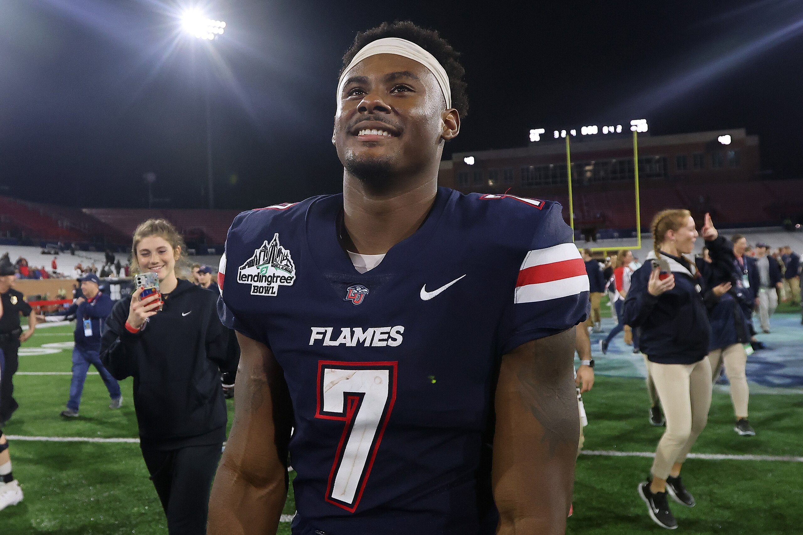 MOBILE, ALABAMA - DECEMBER 18: Malik Willis #7 of the Liberty Flames reacts during the LendingTree Bowl at Hancock Whitney Stadium on December 18, 2021 in Mobile, Alabama. (Photo by Jonathan Bachman/Getty Images)