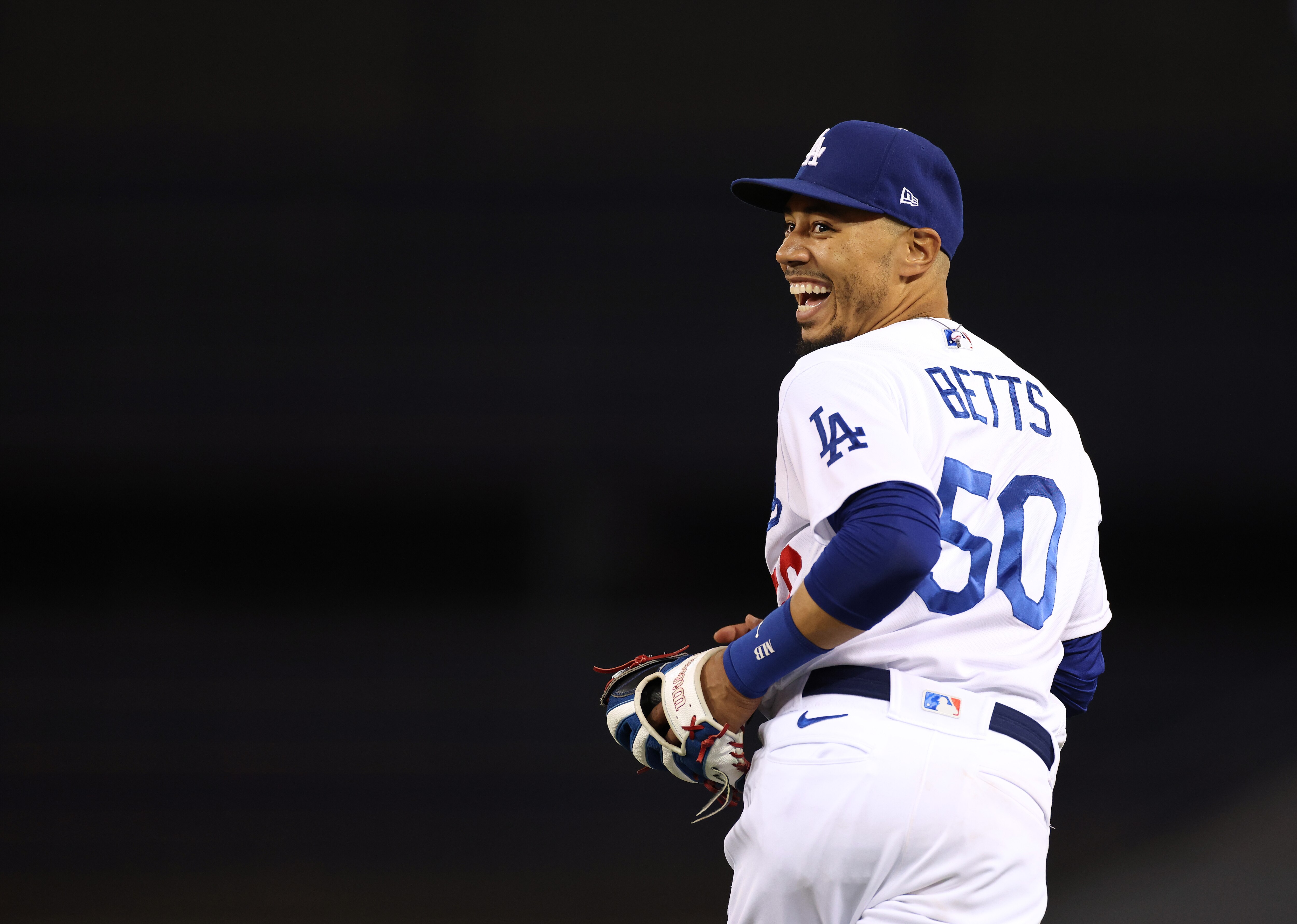 LOS ANGELES, CALIFORNIA - SEPTEMBER 10: Mookie Betts #50 of the Los Angeles Dodgers reacts after his catch for an out of Austin Nola #26 of the San Diego Padres during the ninth inning in a 3-0 win at Dodger Stadium on September 10, 2021 in Los Angeles, California. (Photo by Harry How/Getty Images)