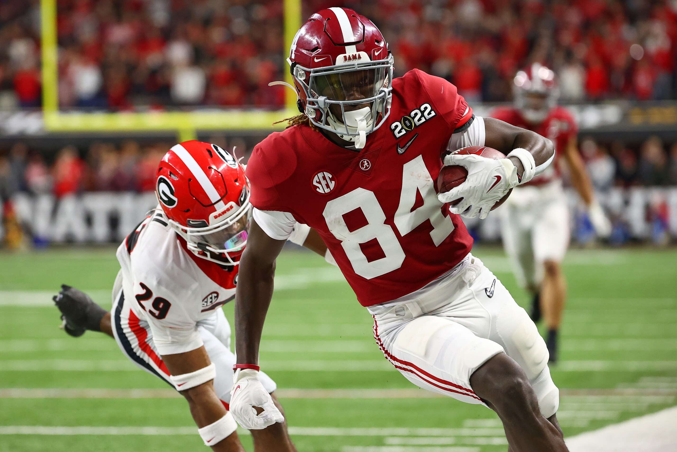 INDIANAPOLIS, IN - JANUARY 10: Agiye Hall #84 of the Alabama Crimson Tide makes a reception against the Georgia Bulldogs during the College Football Playoff Championship held at Lucas Oil Stadium on January 10, 2022 in Indianapolis, Indiana. (Photo by Jamie Schwaberow/Getty Images)