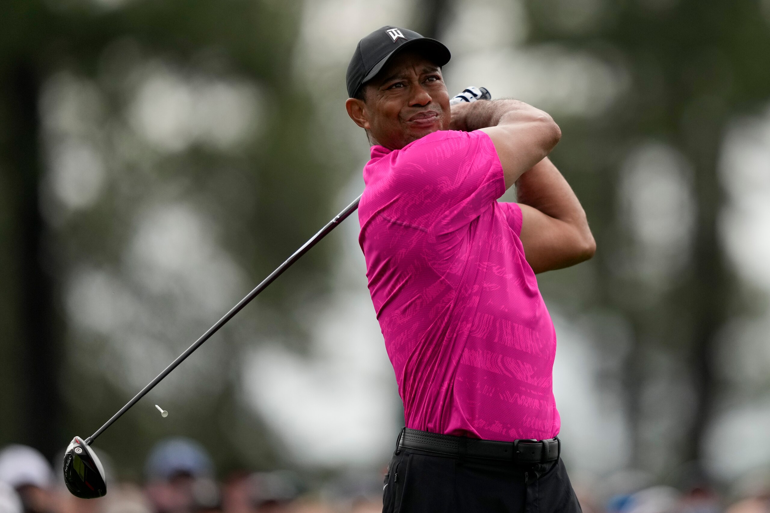 Tiger Woods watches his tee shot on the first hole during the first round at the Masters golf tournament on Thursday, April 7, 2022, in Augusta, Ga. (AP Photo/Matt Slocum)