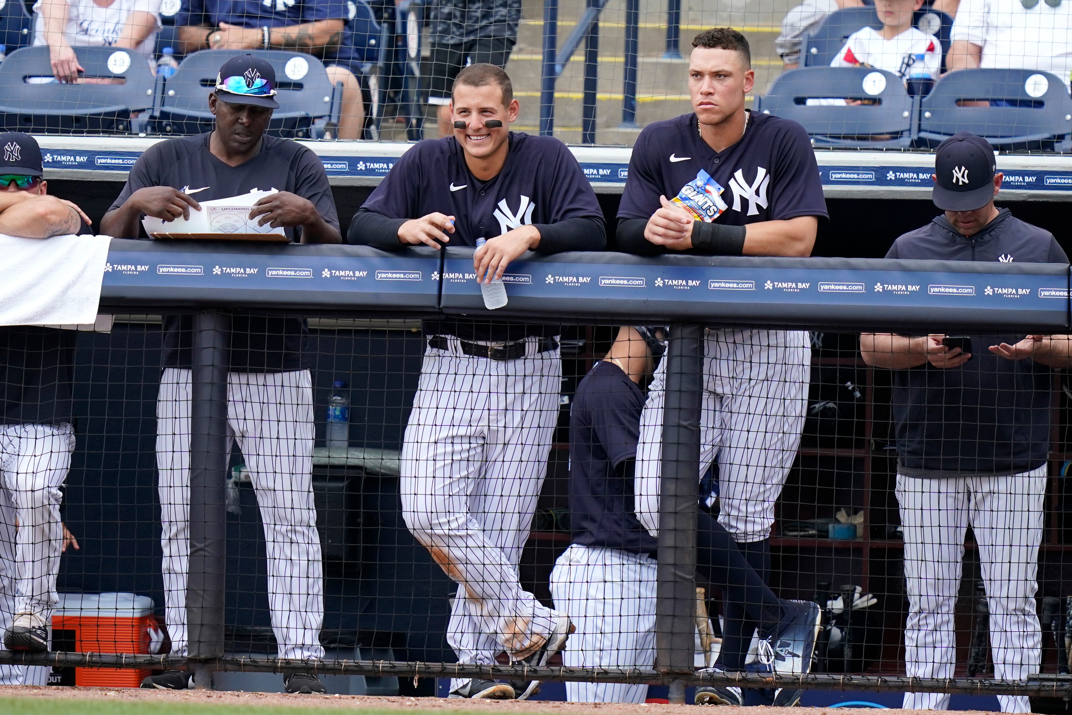 New York Yankees' Anthony Rizzo, left, and right fielder Aaron Judge, right, watch from the dugout during a spring training baseball game against the Atlanta Braves, Saturday, April 2, 2022, in Tampa, Fla. (AP Photo/Lynne Sladky)