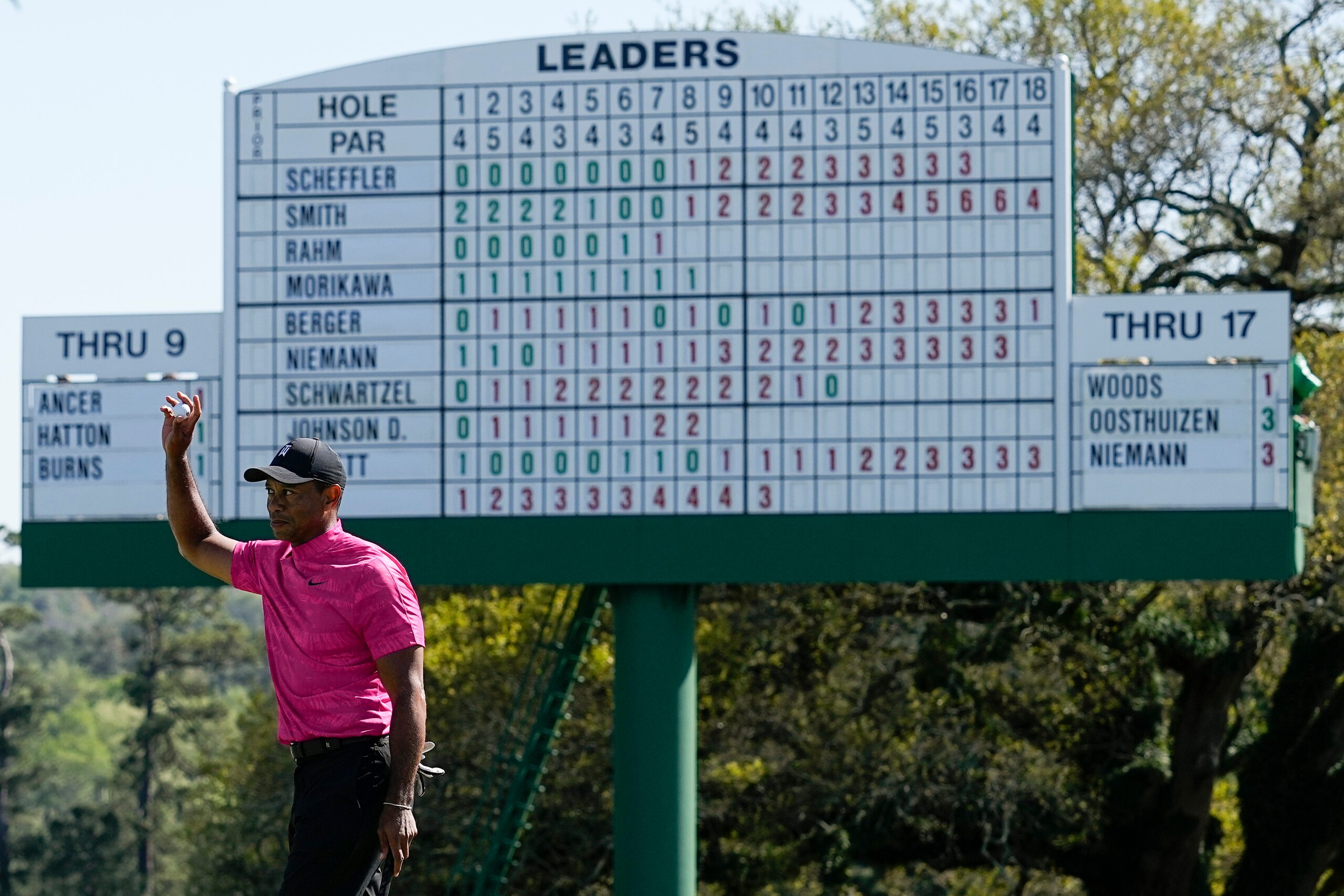 Tiger Woods holds up his ball after playing out the 18th hole during the first round at the Masters golf tournament on Thursday, April 7, 2022, in Augusta, Ga. (AP Photo/Robert F. Bukaty)