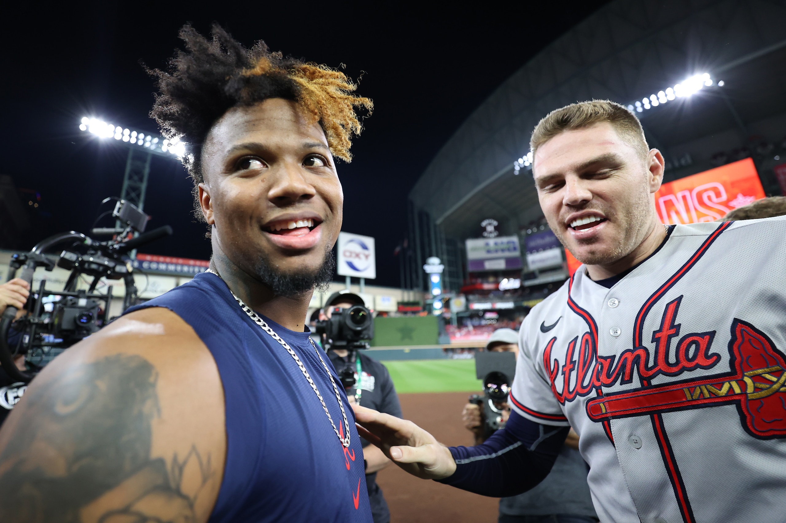 HOUSTON, TEXAS - NOVEMBER 02:  Freddie Freeman #5 and Ronald Acuna Jr. #13 of the Atlanta Braves celebrate their 7-0 victory against the Houston Astros in Game Six to win the 2021 World Series at Minute Maid Park on November 02, 2021 in Houston, Texas. (Photo by Carmen Mandato/Getty Images)