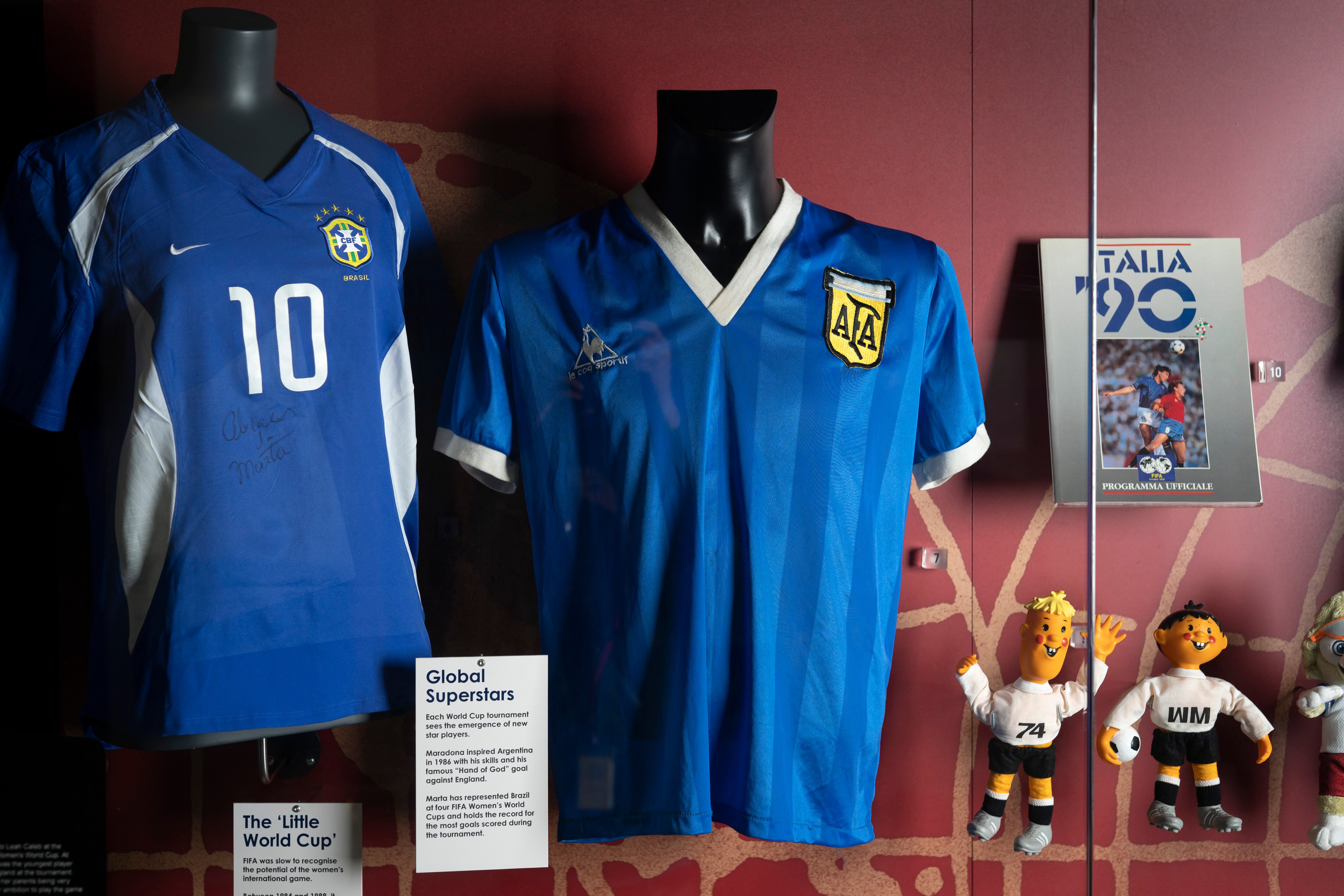 FILE - The soccer shirt, center, worn by Argentina's Diego Maradona in the 1986 World Cup quarterfinal against England is displayed at the National Football Museum in Manchester, England Nov. 26, 2020. The shirt worn by Diego Maradona when he scored the controversial “Hand of God” goal against England in the 1986 World Cup is for sale for the first time. Auctioneer Sotheby’s said Wednesday, April 6, 2022 that the jersey could fetch more than 4 million pounds ($5.2 million) in an online auction that opens April 20. (AP Photo/Jon Super, file)