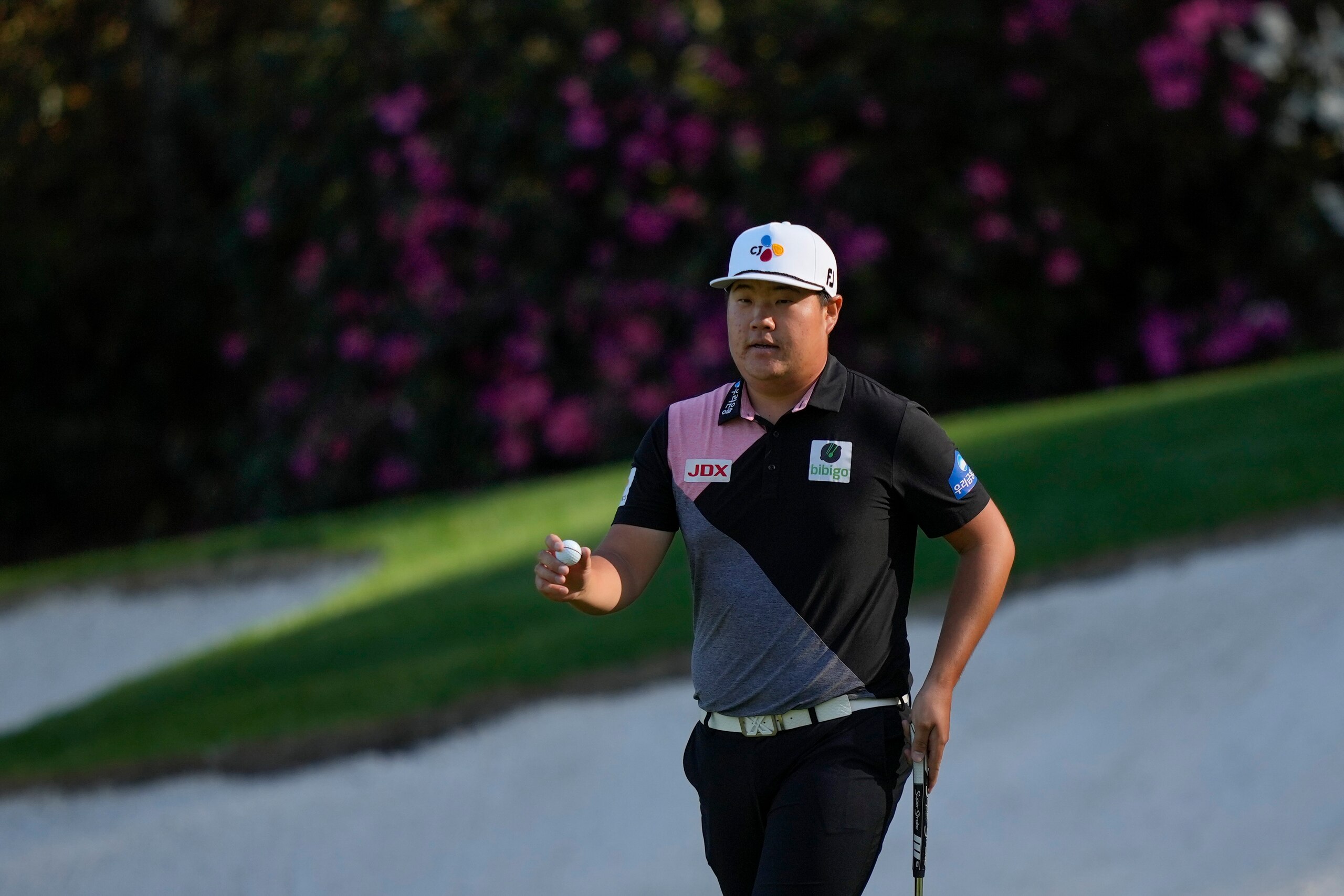 Sungjae Im, of South Korea, holds up his ball on the 13th green during the first round at the Masters golf tournament on Thursday, April 7, 2022, in Augusta, Ga. (AP Photo/Matt Slocum) Sungjae Im, of South Korea, holds up his ball on the 13th green during the first round at the Masters golf tournament on Thursday, April 7, 2022, in Augusta, Ga. (AP Photo/Matt Slocum)