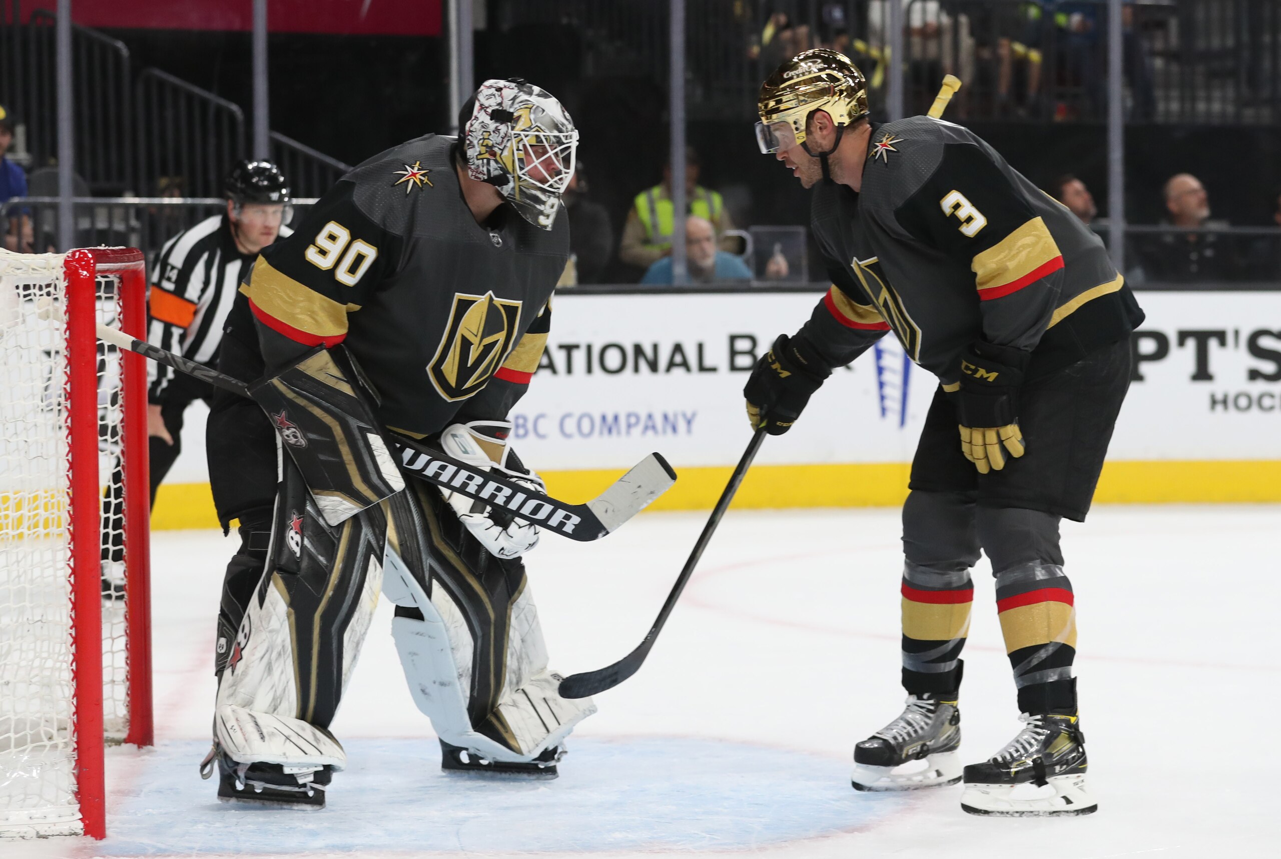 LAS VEGAS, NEVADA - APRIL 06: Robin Lehner #90 and Brayden McNabb #3 of the Vegas Golden Knights talk during the first period against the Vancouver Canucks at T-Mobile Arena on April 06, 2022 in Las Vegas, Nevada. (Photo by Zak Krill/NHLI via Getty Images)
