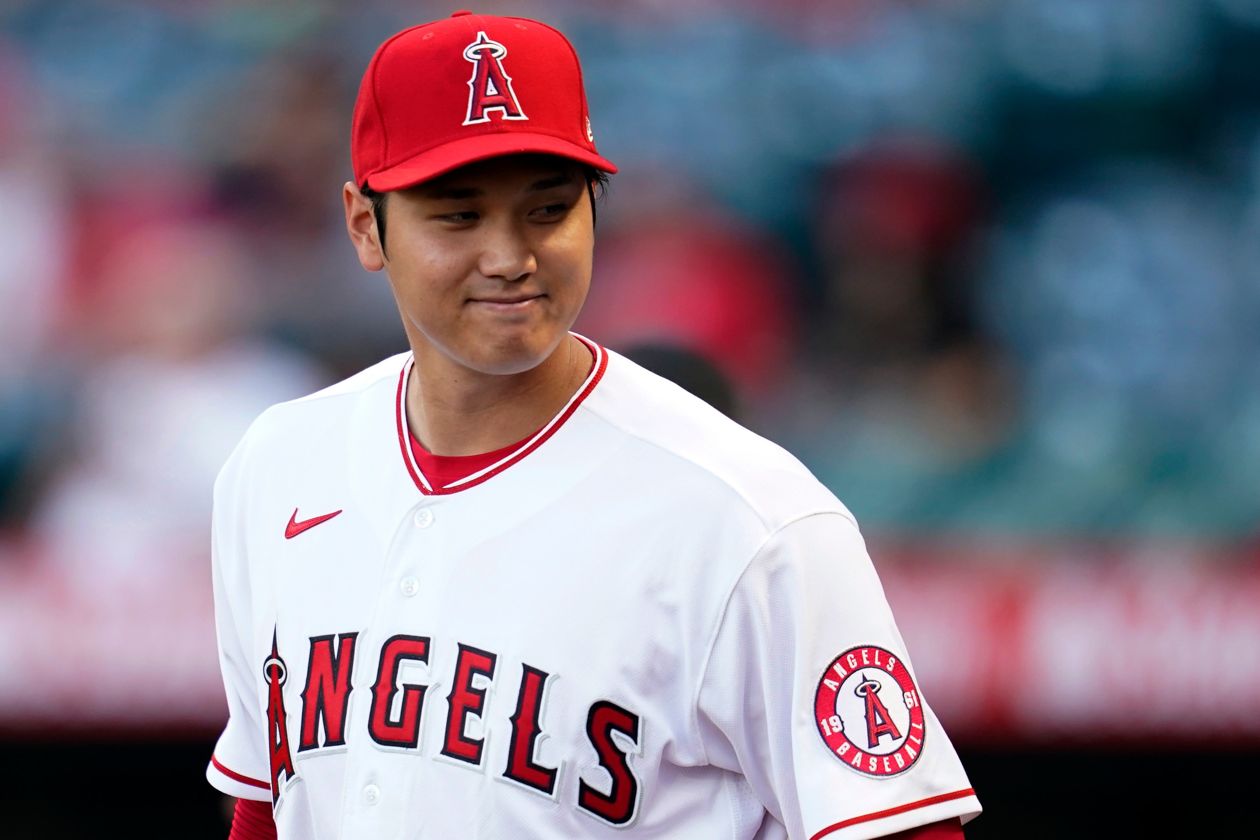Los Angeles Angels starting pitcher Shohei Ohtani smiles on the field before the team's baseball game against the Houston Astros on Thursday, April 7, 2022, in Anaheim, Calif. (AP Photo/Ashley Landis)