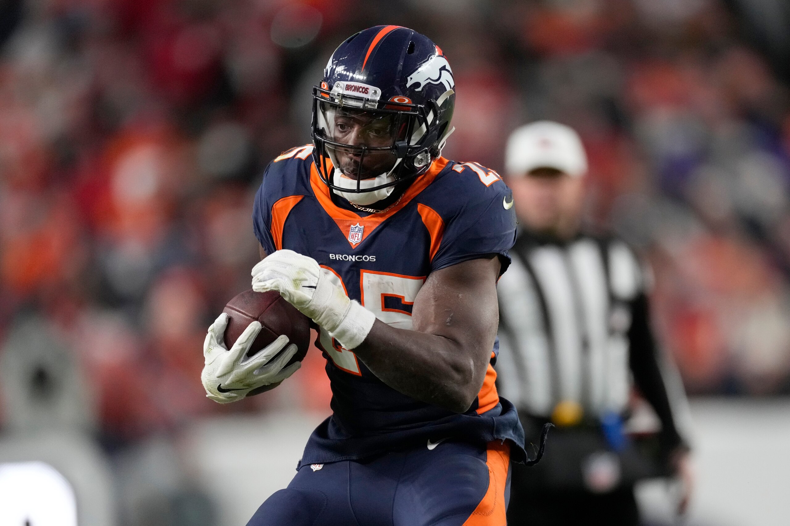 Denver Broncos running back Melvin Gordon III (25) runs against the Kansas City Chiefs during the second half of an NFL football game Saturday, Jan. 8, 2022, in Denver. (AP Photo/David Zalubowski)