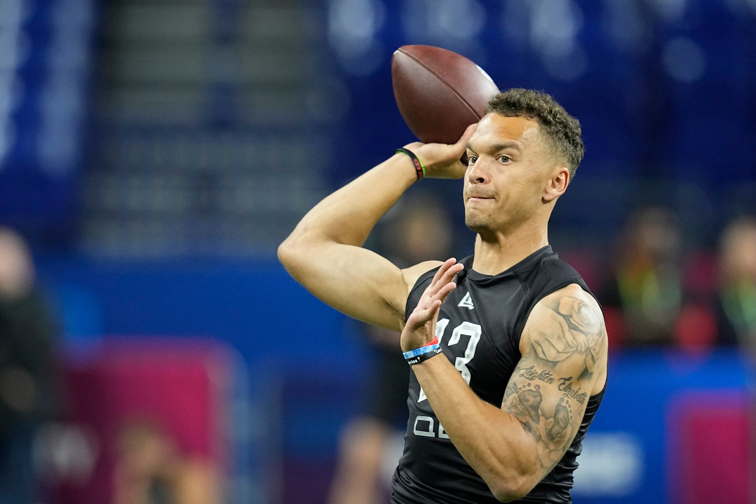 Cincinnati quarterback Desmond Ridder throws during the NFL football scouting combine, Thursday, March 3, 2022, in Indianapolis. (AP Photo/Darron Cummings)