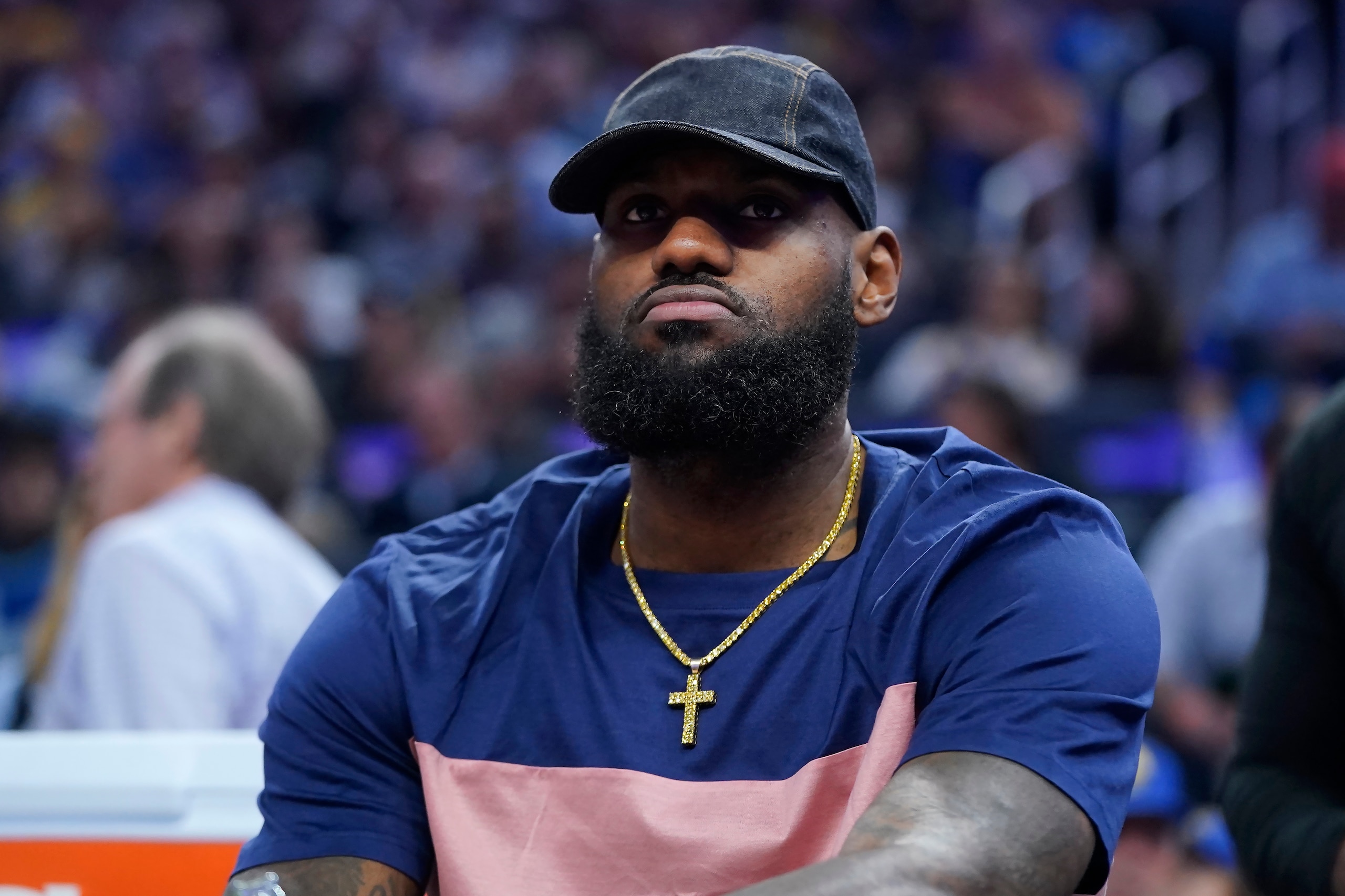 Los Angeles Lakers' LeBron James sits on the bench during the first half of the team's NBA basketball game against the Golden State Warriors in San Francisco, Thursday, April 7, 2022. (AP Photo/Jeff Chiu)