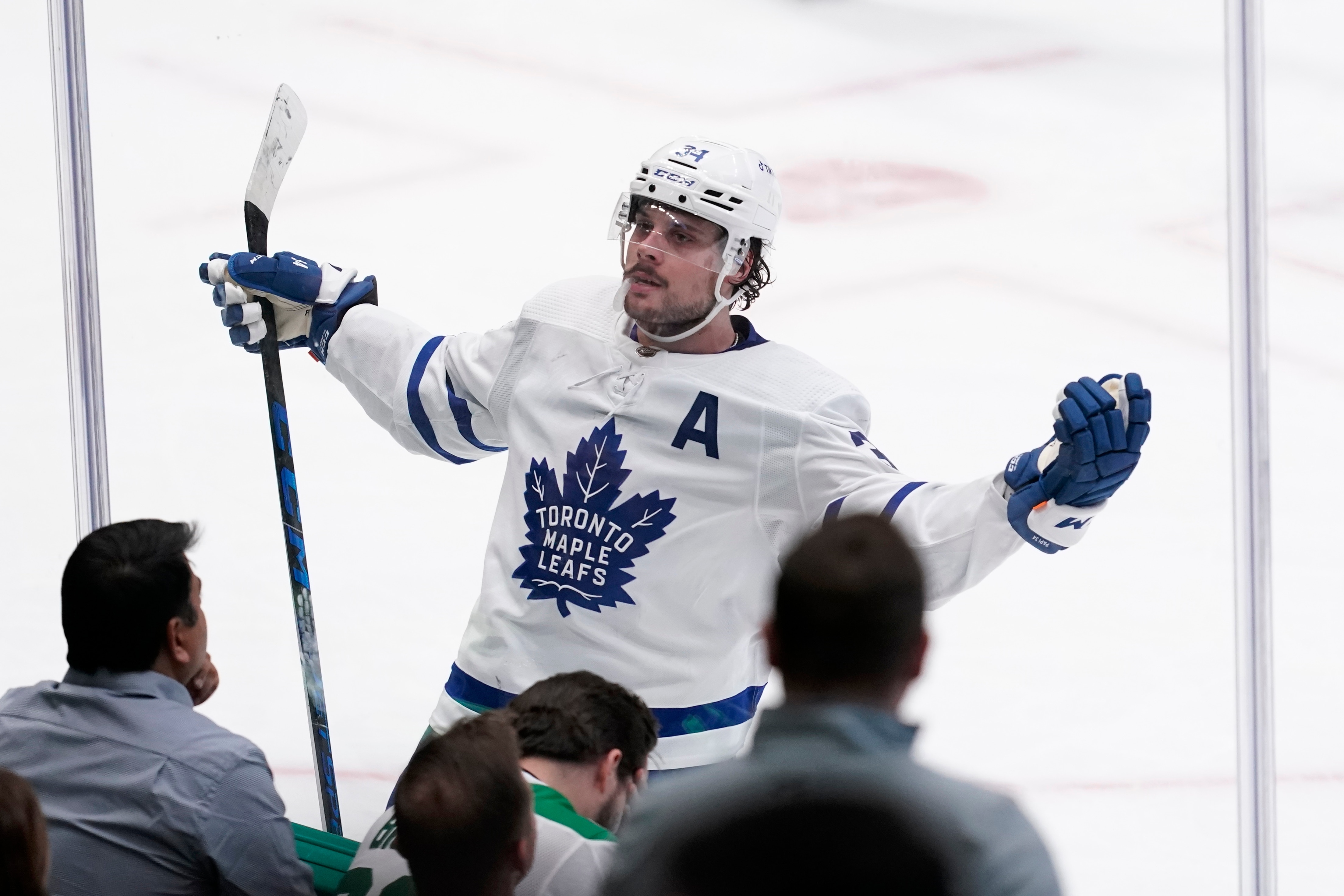 Toronto Maple Leafs center Auston Matthews celebrates in the direction of fans after scoring in overtime of an NHL hockey game against the Dallas Stars, Thursday, April 7, 2022, in Dallas. The Maple Leafs won 4-3. (AP Photo/Tony Gutierrez)