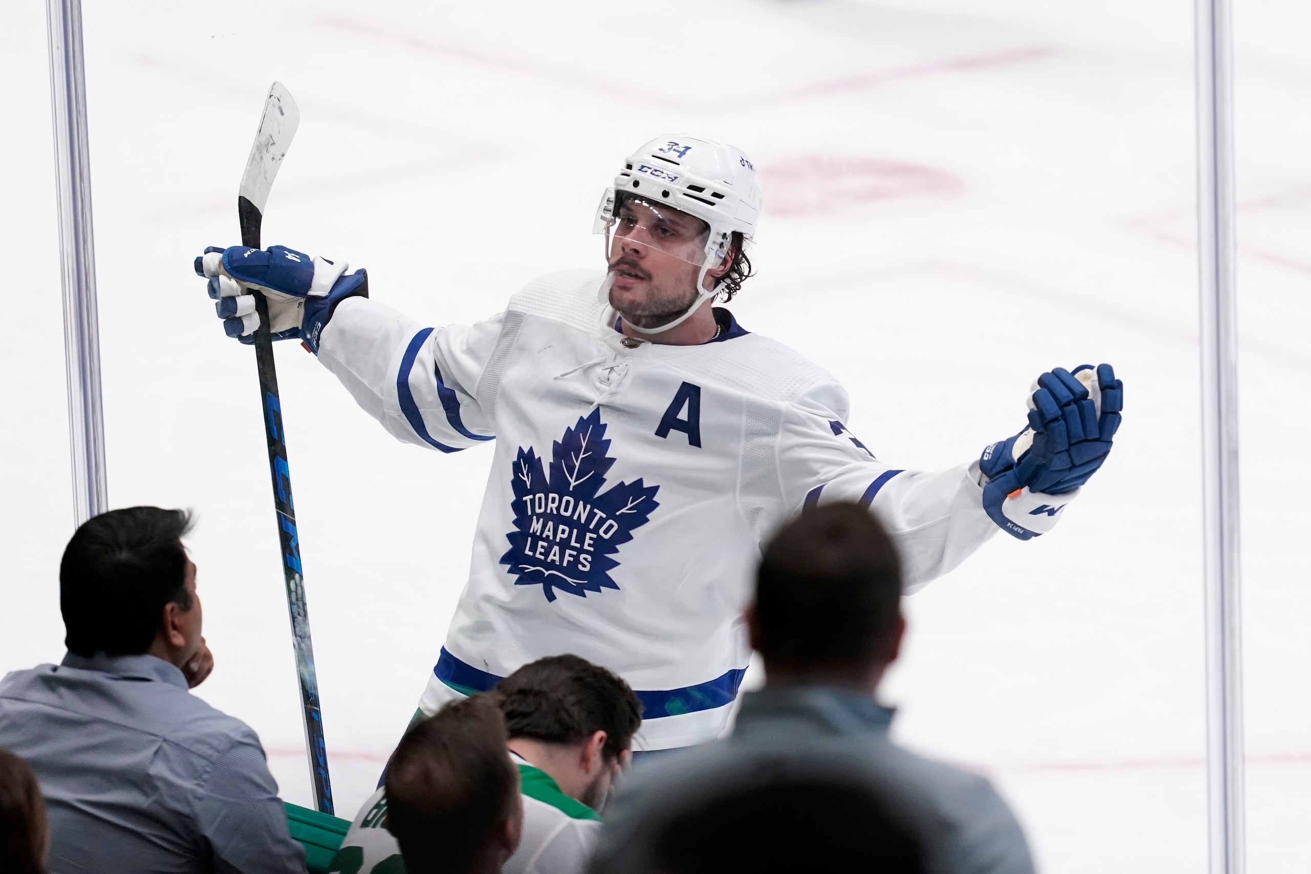 Toronto Maple Leafs center Auston Matthews celebrates in the direction of fans after scoring in overtime of an NHL hockey game against the Dallas Stars, Thursday, April 7, 2022, in Dallas. The Maple Leafs won 4-3. (AP Photo/Tony Gutierrez)