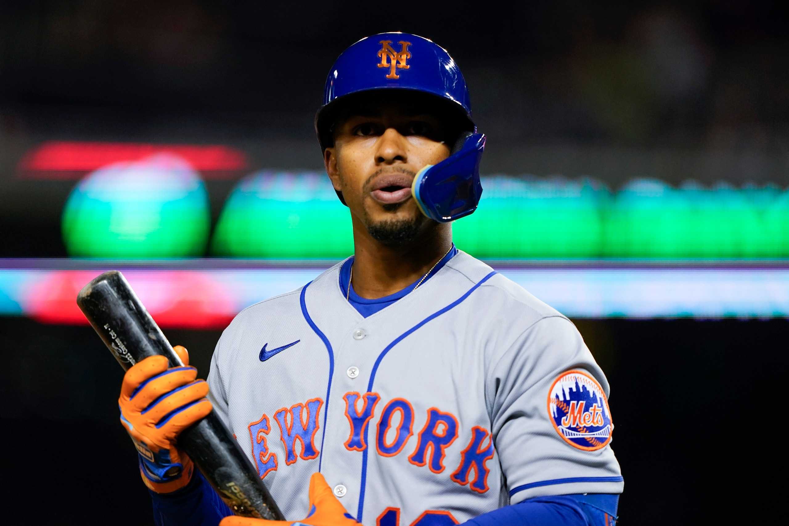 New York Mets' Francisco Lindor walks back to the dugout after striking out against Washington Nationals starting pitcher Patrick Corbin during the first inning of an opening day baseball game at Nationals Park, Thursday, April 7, 2022, in Washington. (AP Photo/Alex Brandon)