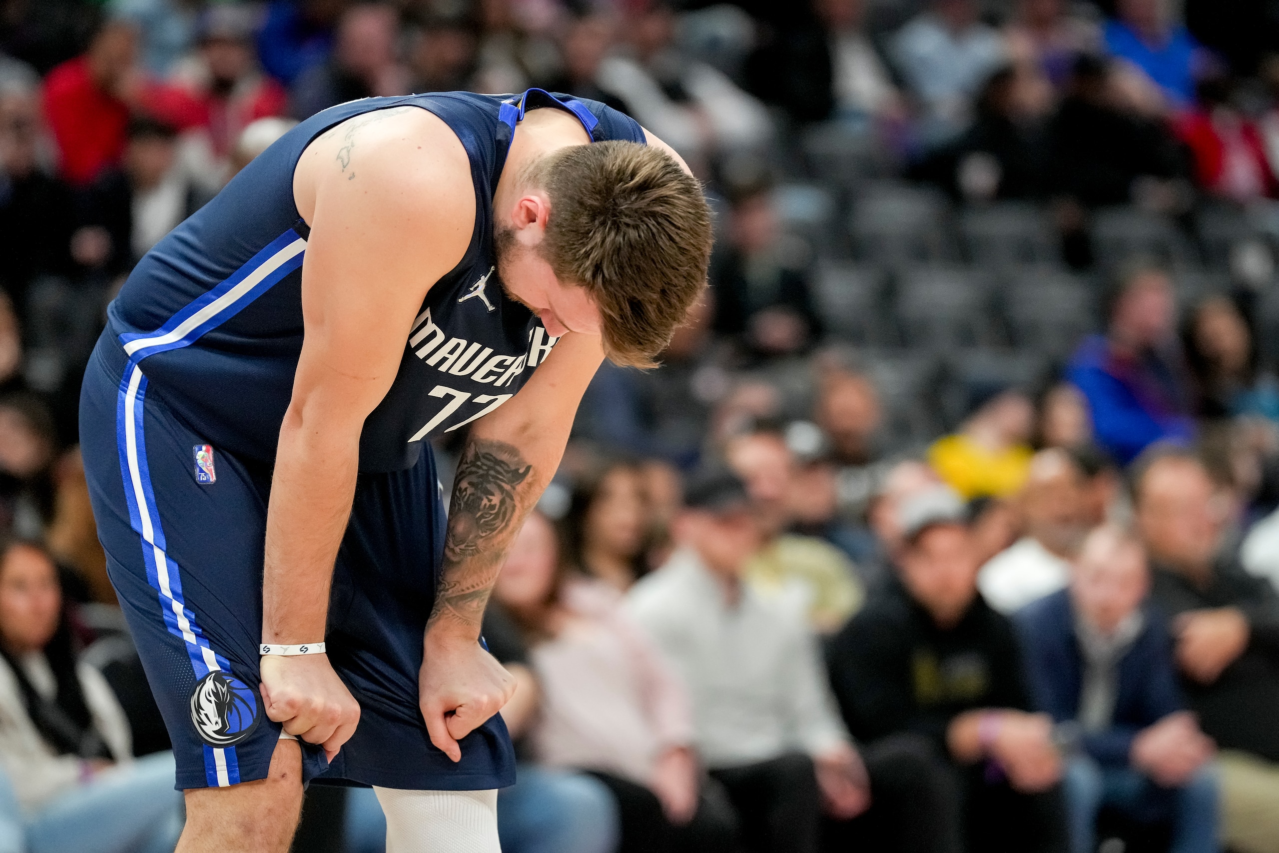 DETROIT, MICHIGAN - APRIL 06: Luka Doncic #77 of the Dallas Mavericks rests during the game against the Detroit Pistons at Little Caesars Arena on April 06, 2022 in Detroit, Michigan. NOTE TO USER: User expressly acknowledges and agrees that, by downloading and or using this photograph, User is consenting to the terms and conditions of the Getty Images License Agreement. (Photo by Nic Antaya/Getty Images) DETROIT, MICHIGAN - APRIL 06: Luka Doncic #77 of the Dallas Mavericks rests during the game against the Detroit Pistons at Little Caesars Arena on April 06, 2022 in Detroit, Michigan. NOTE TO USER: User expressly acknowledges and agrees that, by downloading and or using this photograph, User is consenting to the terms and conditions of the Getty Images License Agreement. (Photo by Nic Antaya/Getty Images)