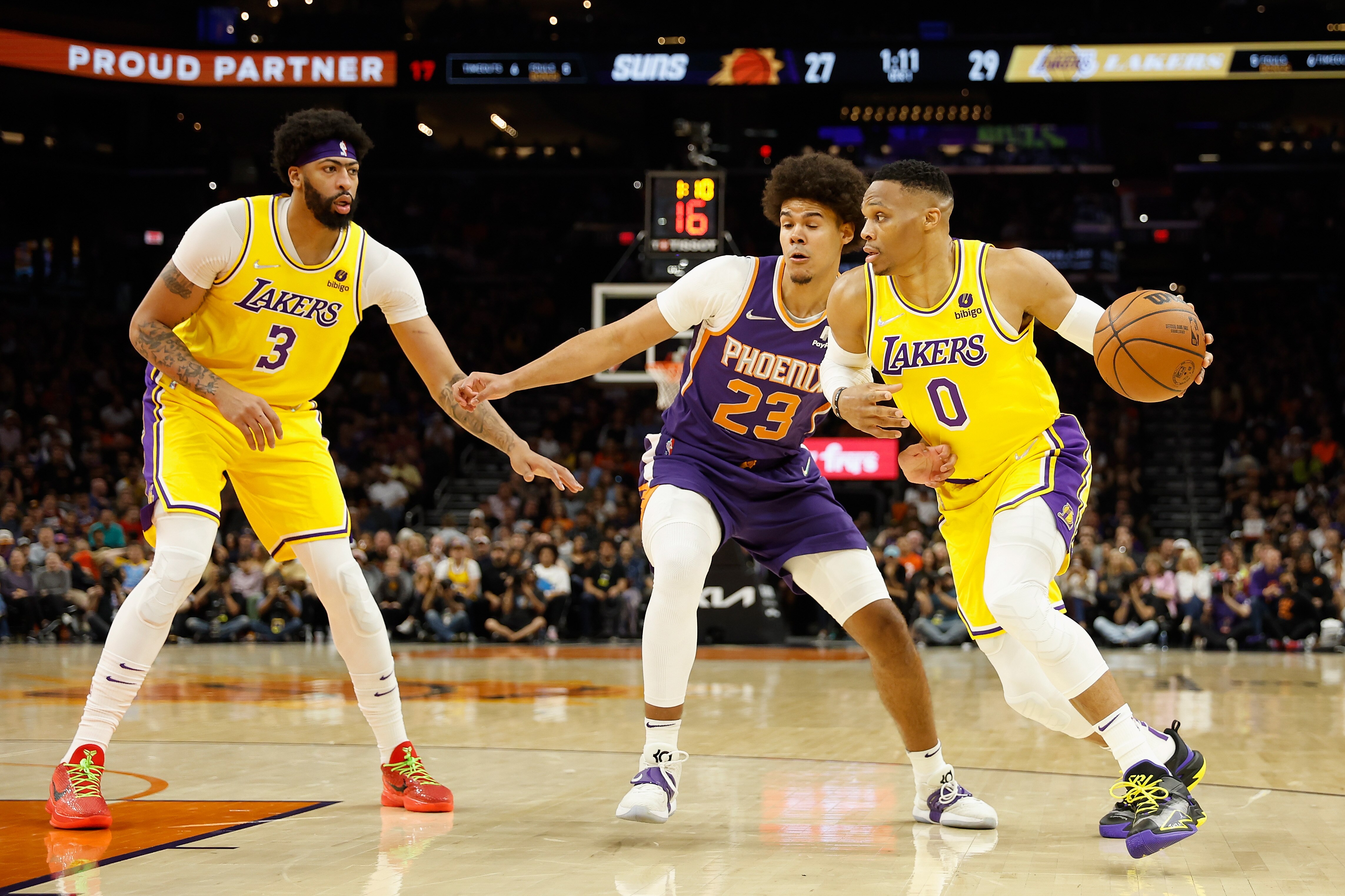 PHOENIX, ARIZONA - APRIL 05: Russell Westbrook #0 of the Los Angeles Lakers handles the ball against Cameron Johnson #23 of the Phoenix Suns during the first half of the NBA game at Footprint Center on April 05, 2022 in Phoenix, Arizona.  NOTE TO USER: User expressly acknowledges and agrees that, 
by downloading and or using this photograph, User is consenting to the terms and conditions of the Getty Images License Agreement. (Photo by Christian Petersen/Getty Images)