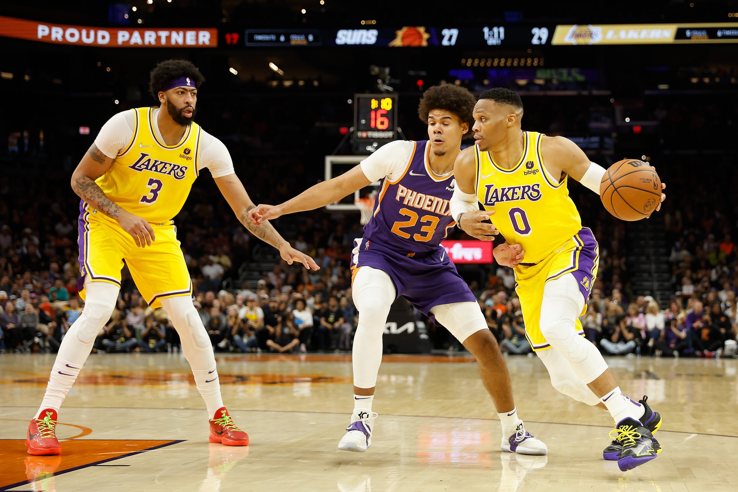 PHOENIX, ARIZONA - APRIL 05: Russell Westbrook #0 of the Los Angeles Lakers handles the ball against Cameron Johnson #23 of the Phoenix Suns during the first half of the NBA game at Footprint Center on April 05, 2022 in Phoenix, Arizona.  NOTE TO USER: User expressly acknowledges and agrees that, 
by downloading and or using this photograph, User is consenting to the terms and conditions of the Getty Images License Agreement. (Photo by Christian Petersen/Getty Images)
