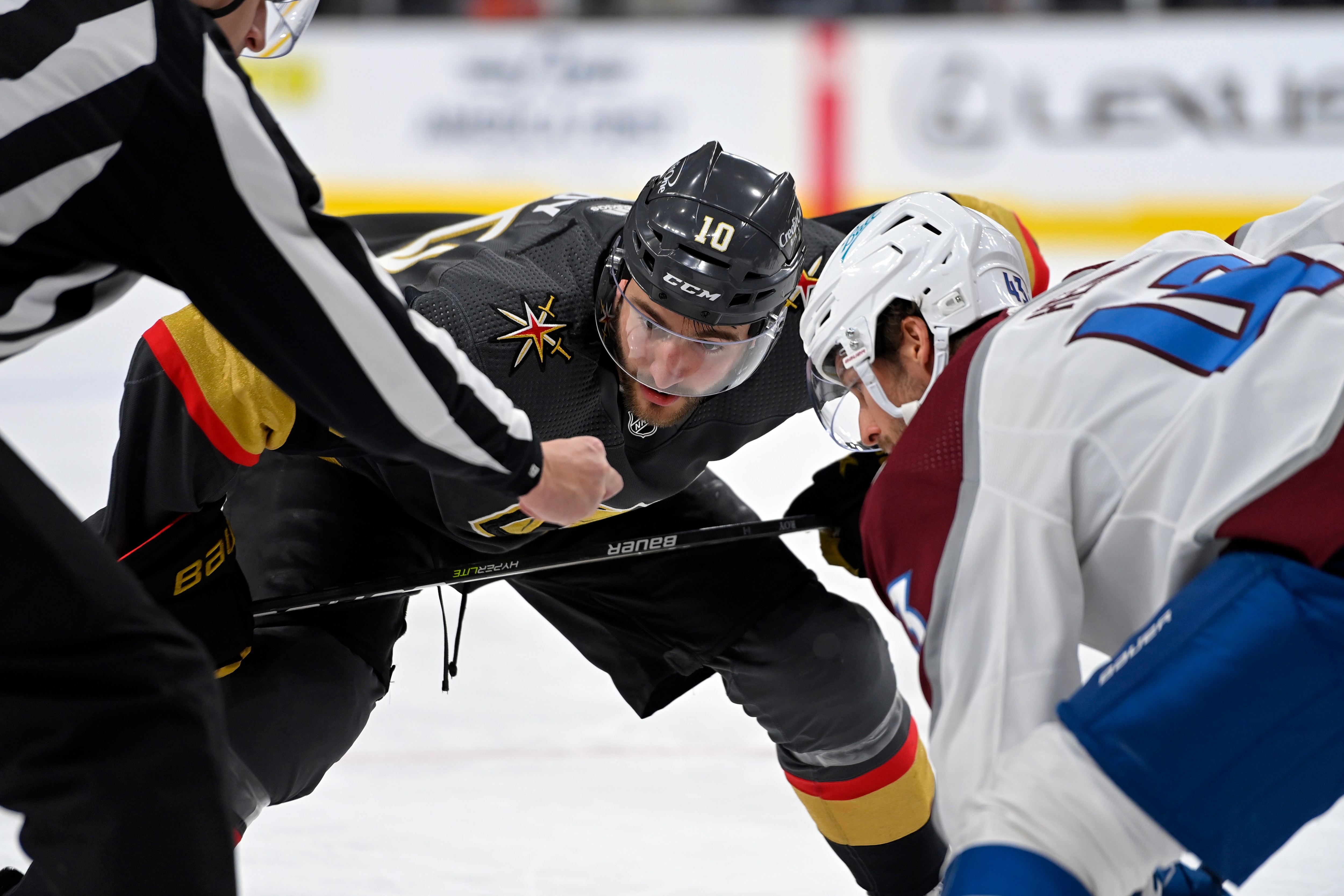 LAS VEGAS, NEVADA - FEBRUARY 26: Nicolas Roy #10 of the Vegas Golden Knights faces off with Darren Helm #43 of the Colorado Avalanche during the third period at T-Mobile Arena on February 26, 2022 in Las Vegas, Nevada. (Photo by David Becker/NHLI via Getty Images)