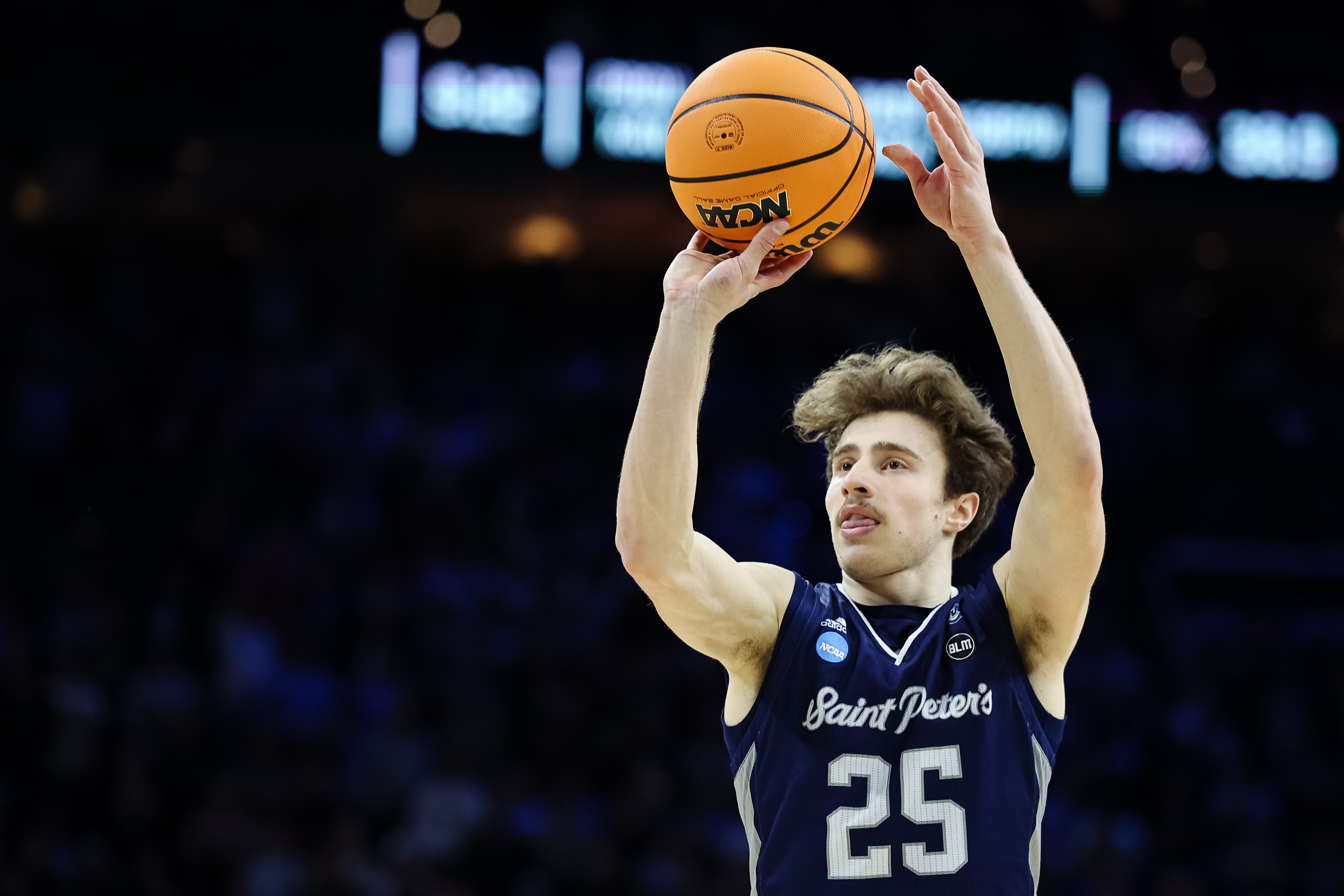 PHILADELPHIA, PA - MARCH 25: Doug Edert #25 of the St. Peter's Peacocks shoots a free throw against the Purdue Boilermakers during the Sweet 16 round of the 2022 NCAA Men's Basketball Tournament held at Wells Fargo Center on March 25, 2022 in Philadelphia, Pennsylvania. (Photo by Scott Taetsch/NCAA Photos via Getty Images)
