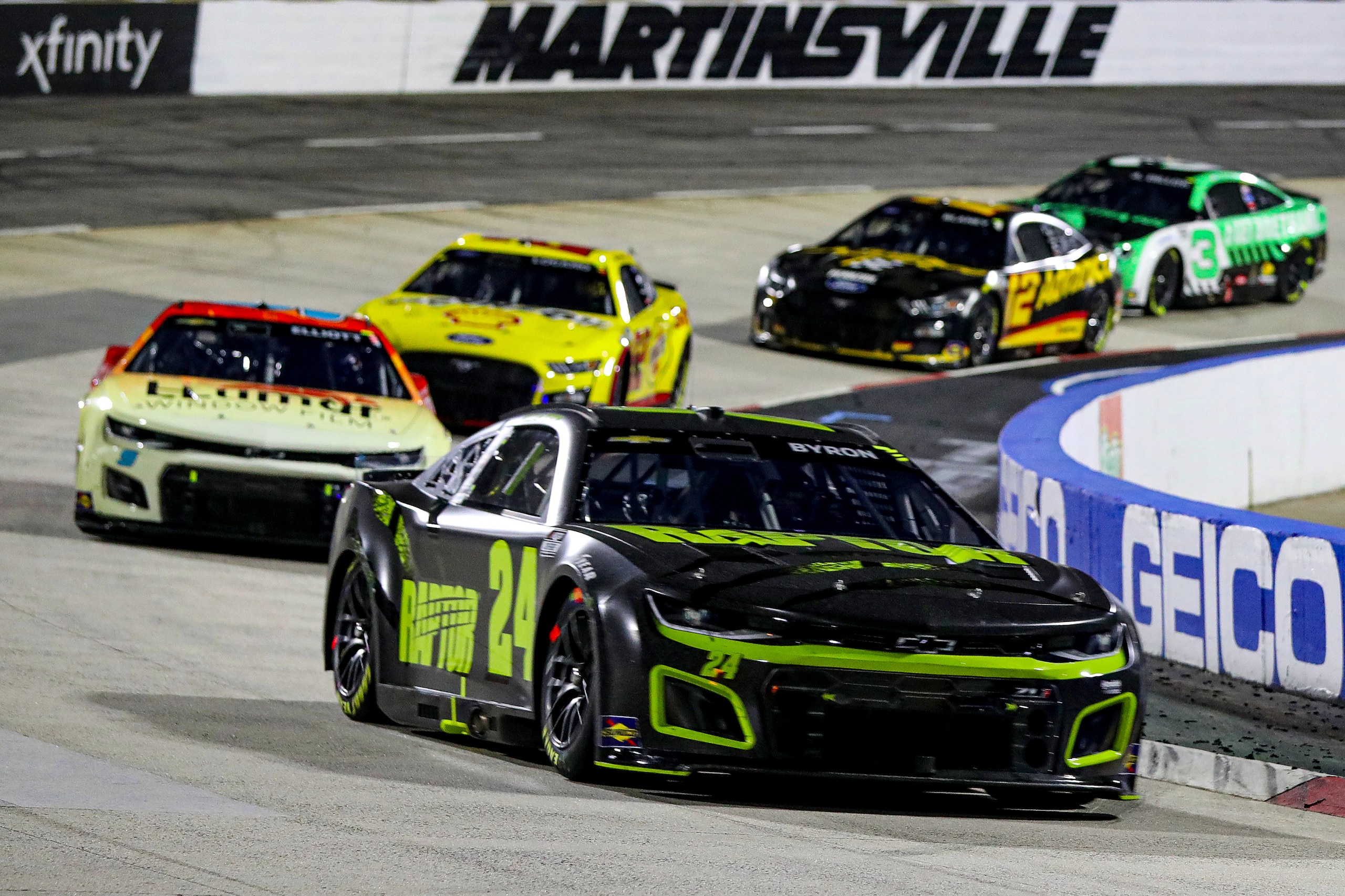 MARTINSVILLE, VIRGINIA - APRIL 09: William Byron, driver of the #24 RaptorTough.com Chevrolet, leads the field during the NASCAR Cup Series Blue-Emu Maximum Pain Relief 400 at Martinsville Speedway on April 09, 2022 in Martinsville, Virginia. (Photo by Meg Oliphant/Getty Images)