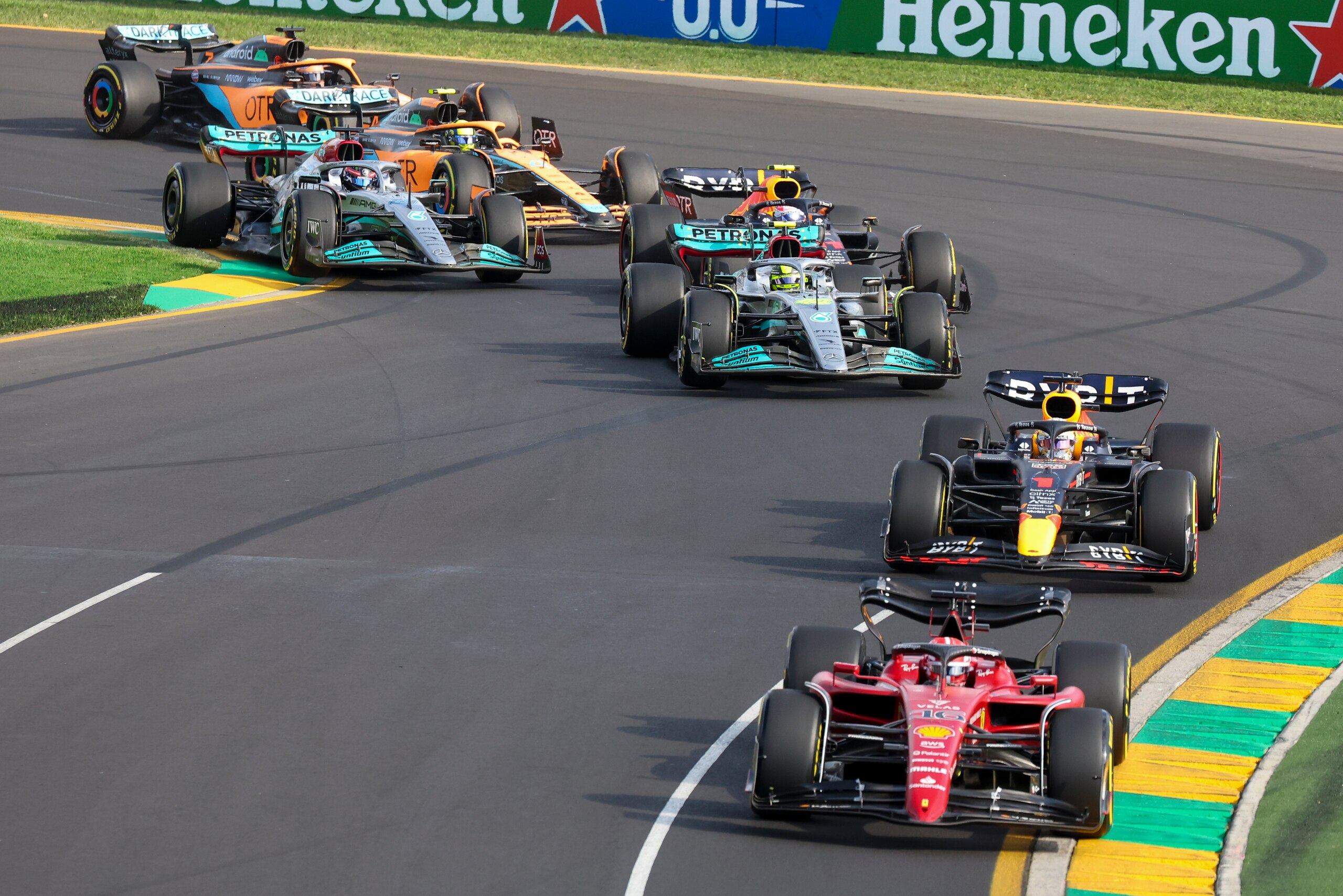 Ferrari driver Charles Leclerc of Monaco leads the field into turn two after the start of the Australian Formula One Grand Prix in Melbourne, Australia, Sunday, April 10, 2022. (AP Photo/Asanka Brendon Ratnayake) Ferrari driver Charles Leclerc of Monaco leads the field into turn two after the start of the Australian Formula One Grand Prix in Melbourne, Australia, Sunday, April 10, 2022. (AP Photo/Asanka Brendon Ratnayake)
